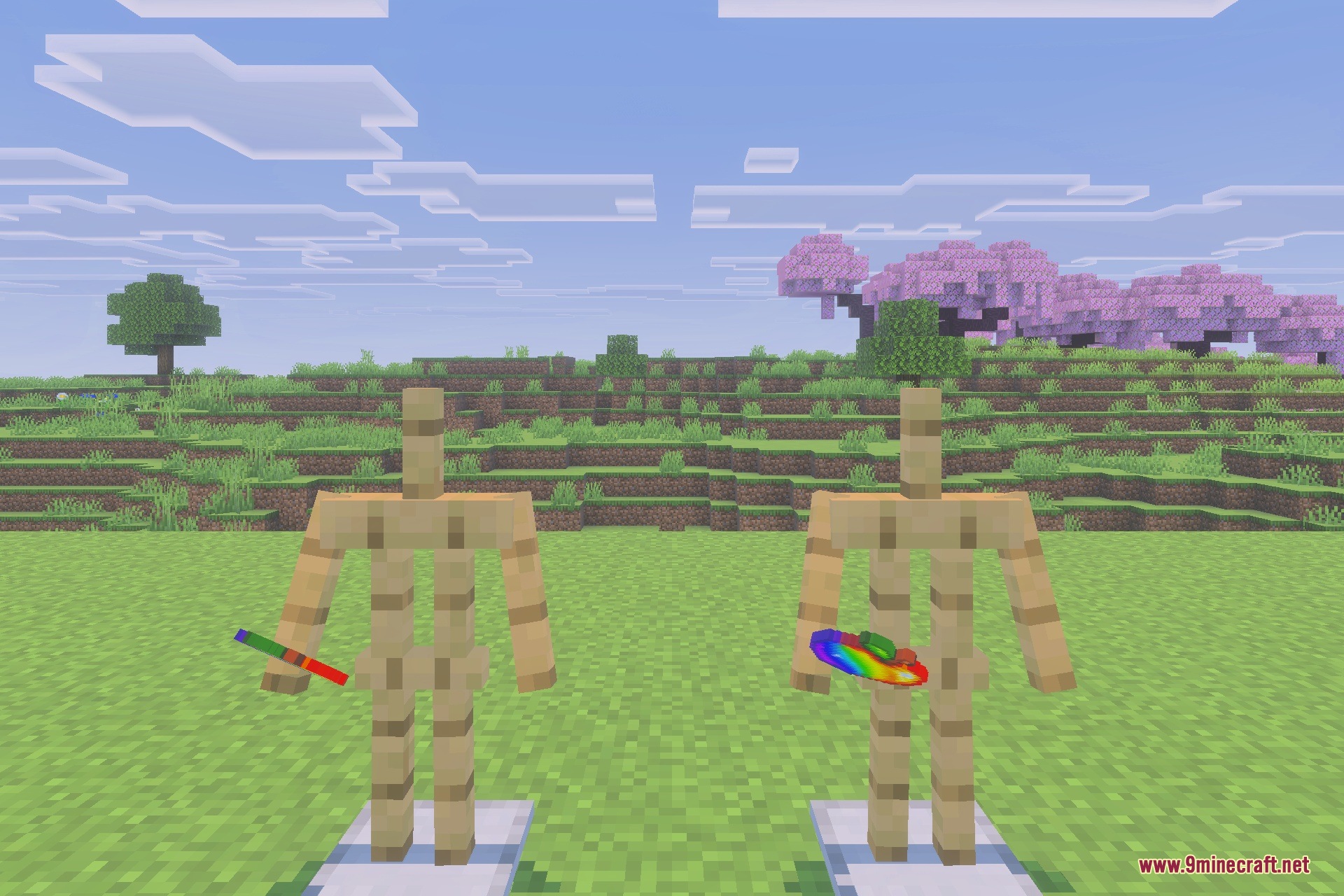 Two armor stands holding unique rainbow colored tools in a grassy field