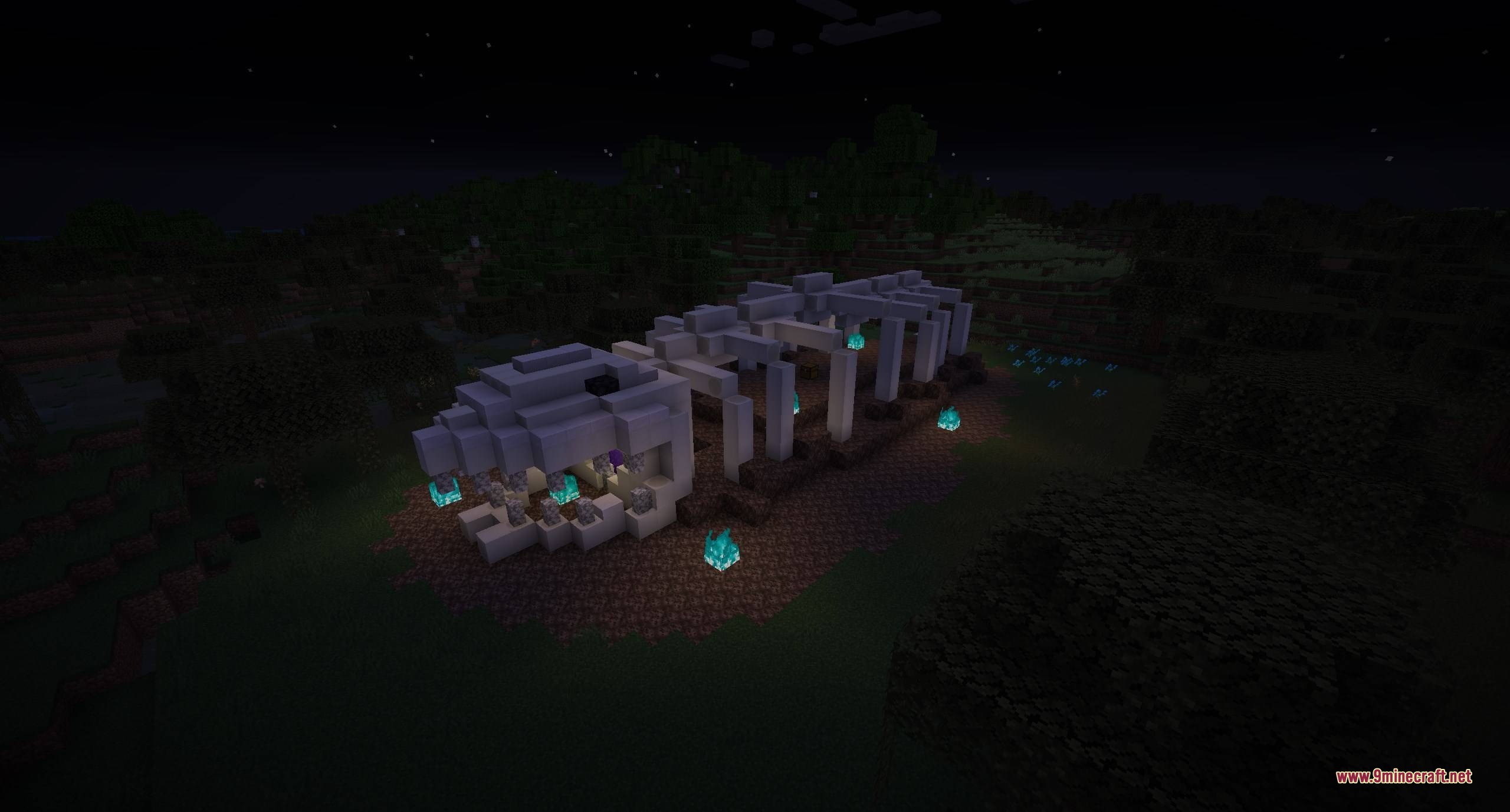 A giant skeleton ribcage structure with soul fire in a dark field