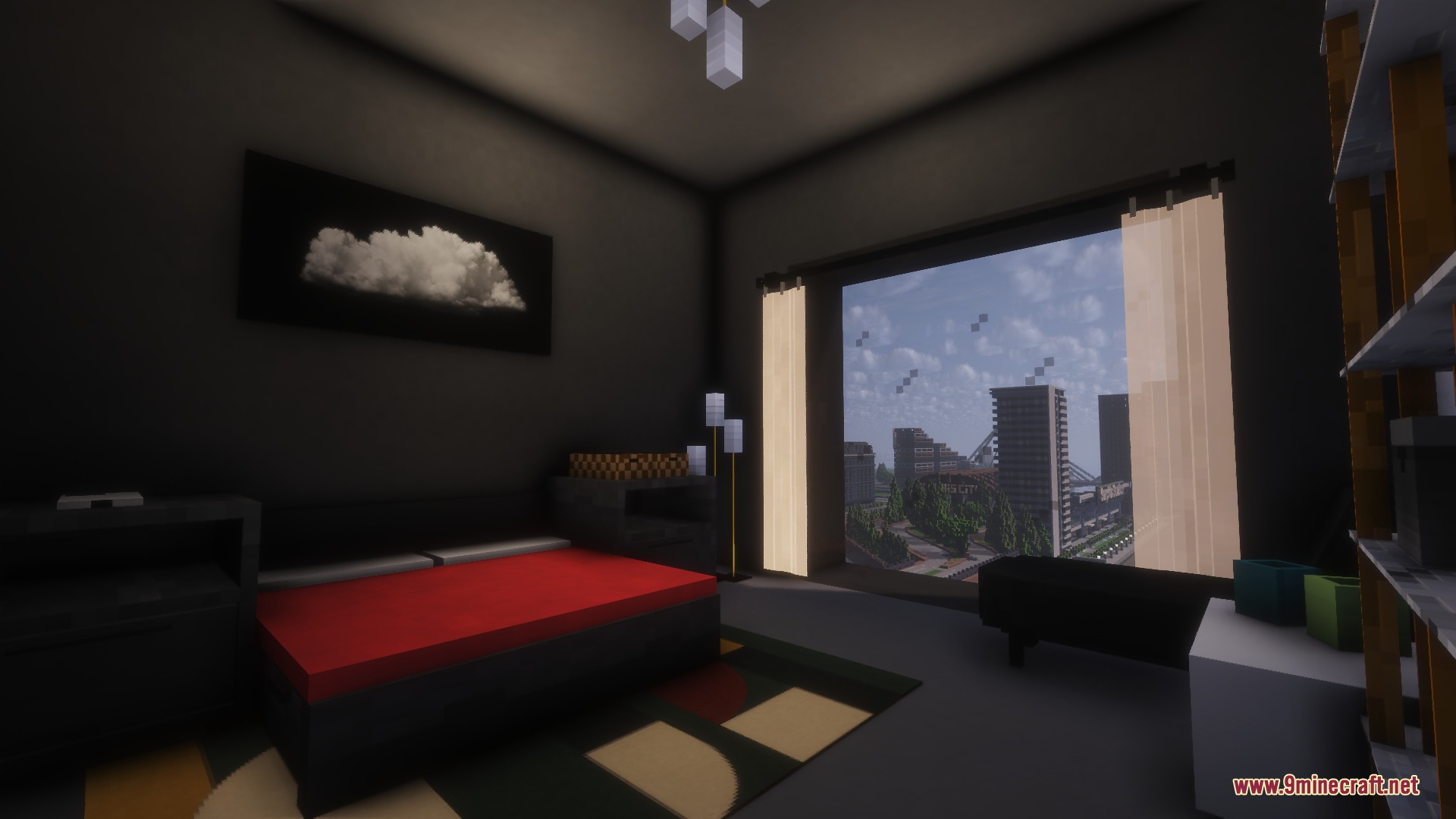 Modern bedroom with a red bed and a large window showing the city