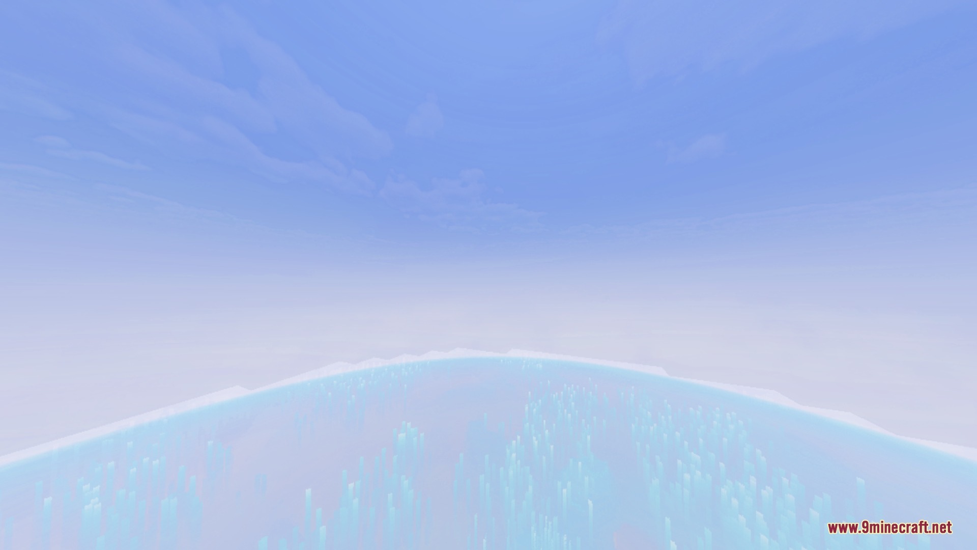 A bright hazy atmosphere with light blue water and pale skies