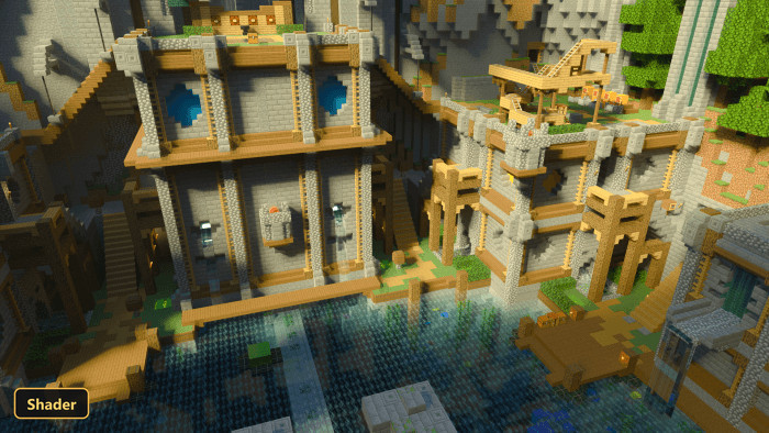 large medieval-style village built into a cliffside, overlooking water