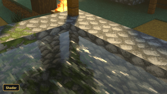 close-up of clear water in a stone trough, reflecting sunlight