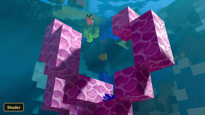 underwater scene with pink coral structures and fish swimming