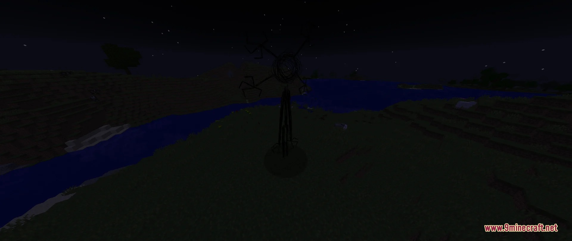 A tall spindly black creature stands in a dark field at night