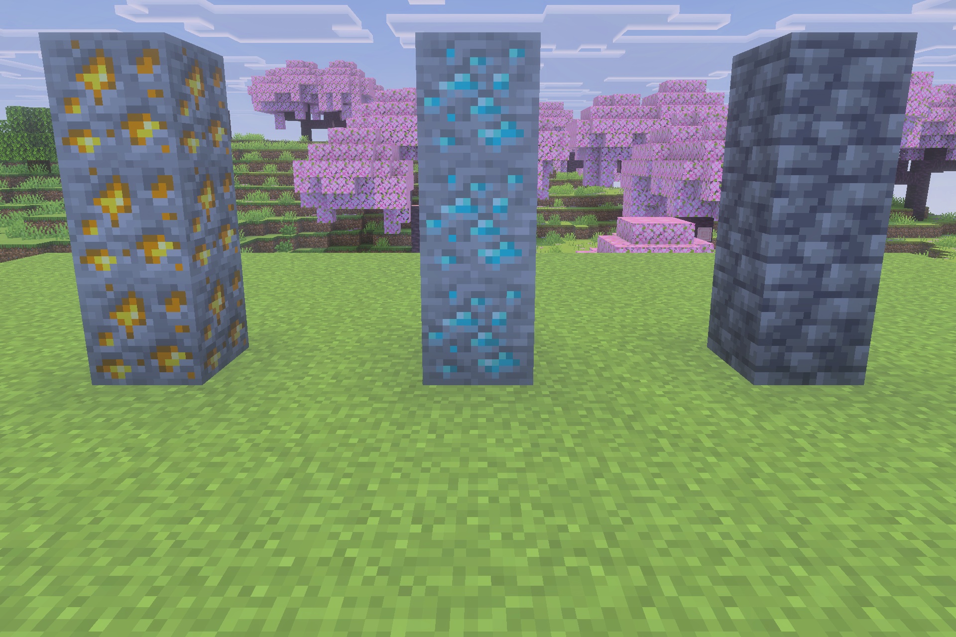Gold and diamond ore blocks standing in a cherry blossom biome