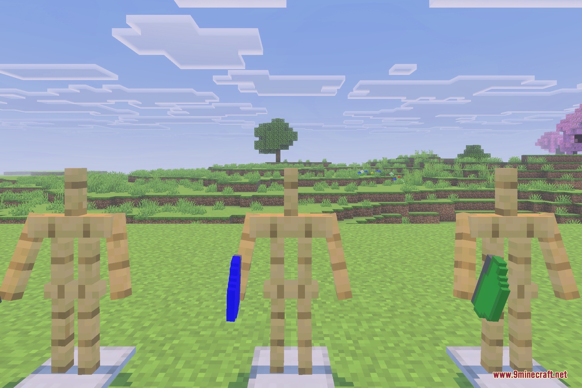 GLOBAL MILITARY ARMOUR Addon Screenshot 3 Three armor stands displaying tactical gear items in a flat grassy field