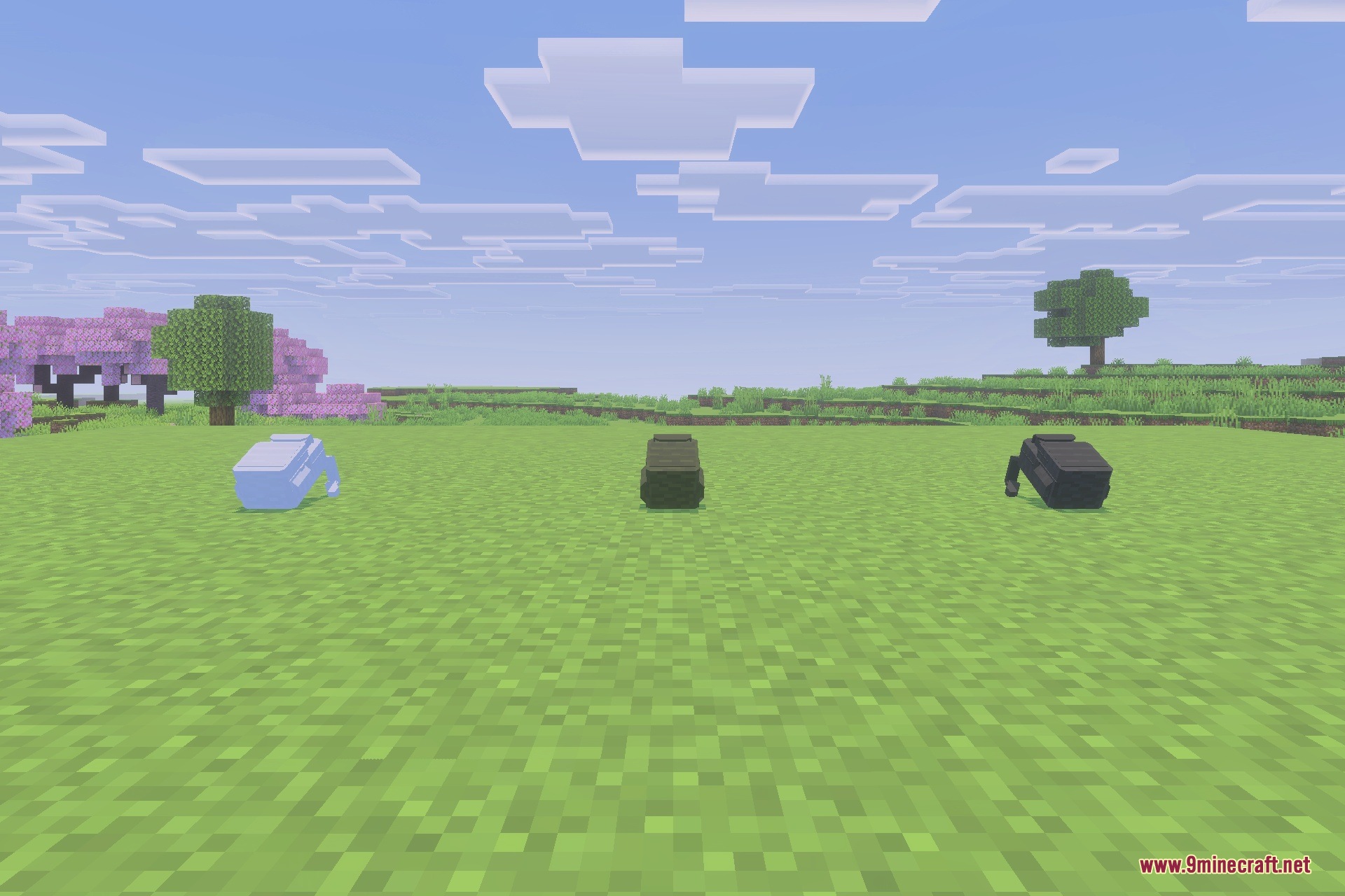 GLOBAL MILITARY ARMOUR Addon Screenshot 4 Three tactical backpacks of different colors placed on the grass in Minecraft
