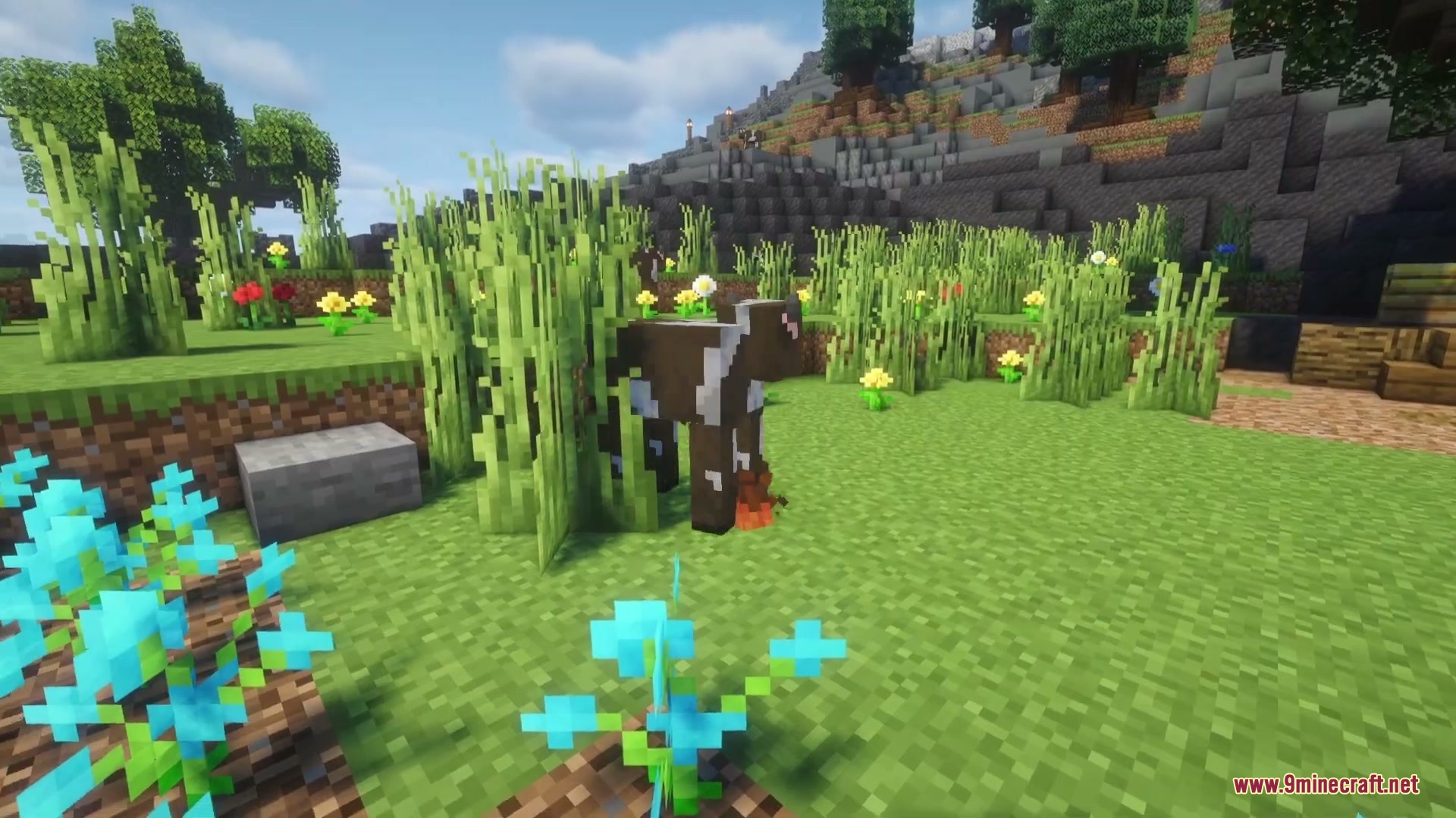 Gigantoscape Horizons Mod Screenshot 3 A brown cow stands in tall grass surrounded by many colorful flowers