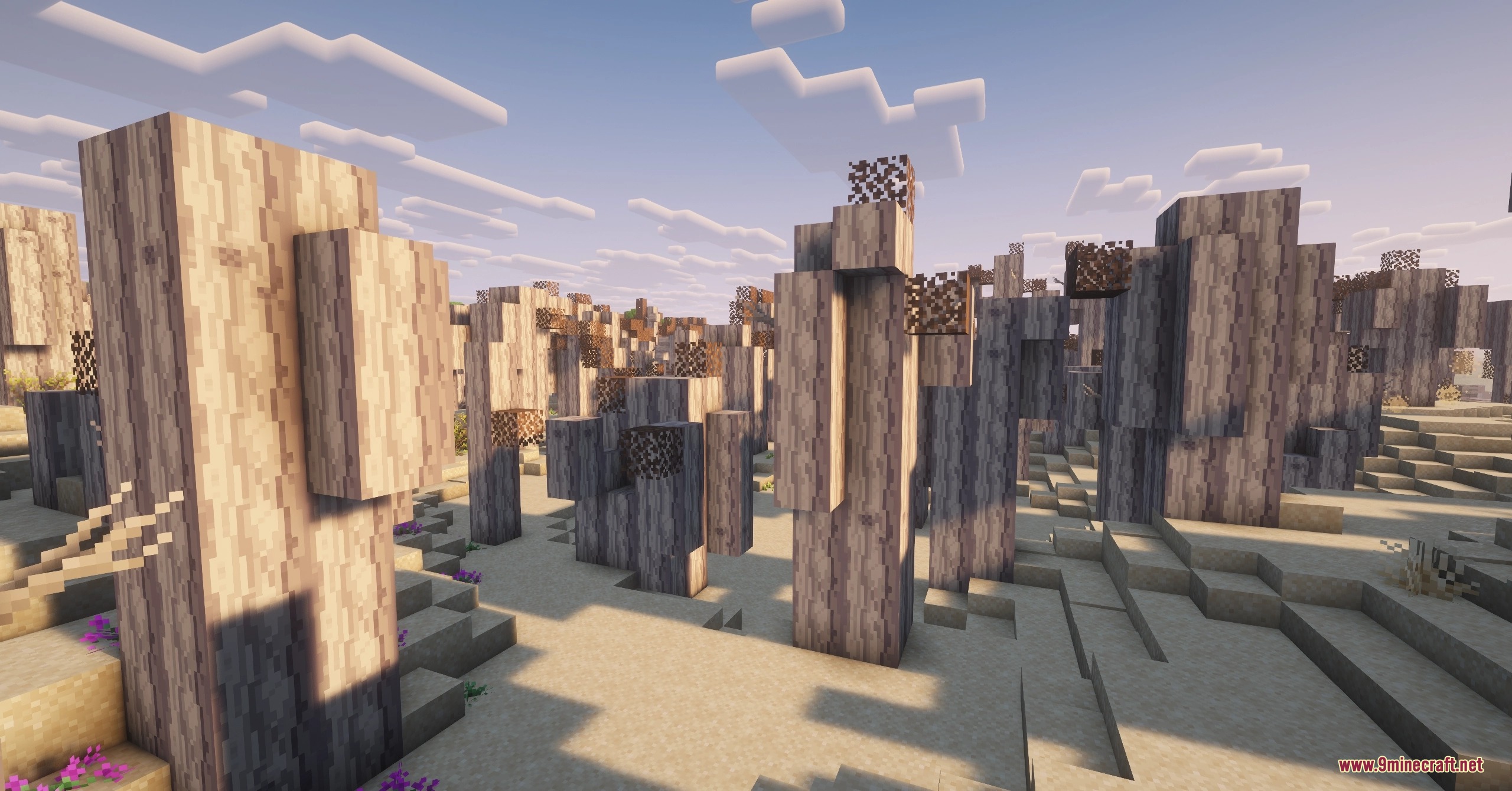 Golden Dune Purge Mod Screenshot 1 Tall petrified wood pillars and desert flora in a dry sandy biome