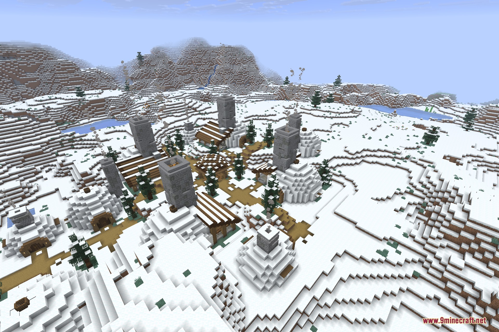 A snowy village with igloos and tall stone towers in a winter landscape
