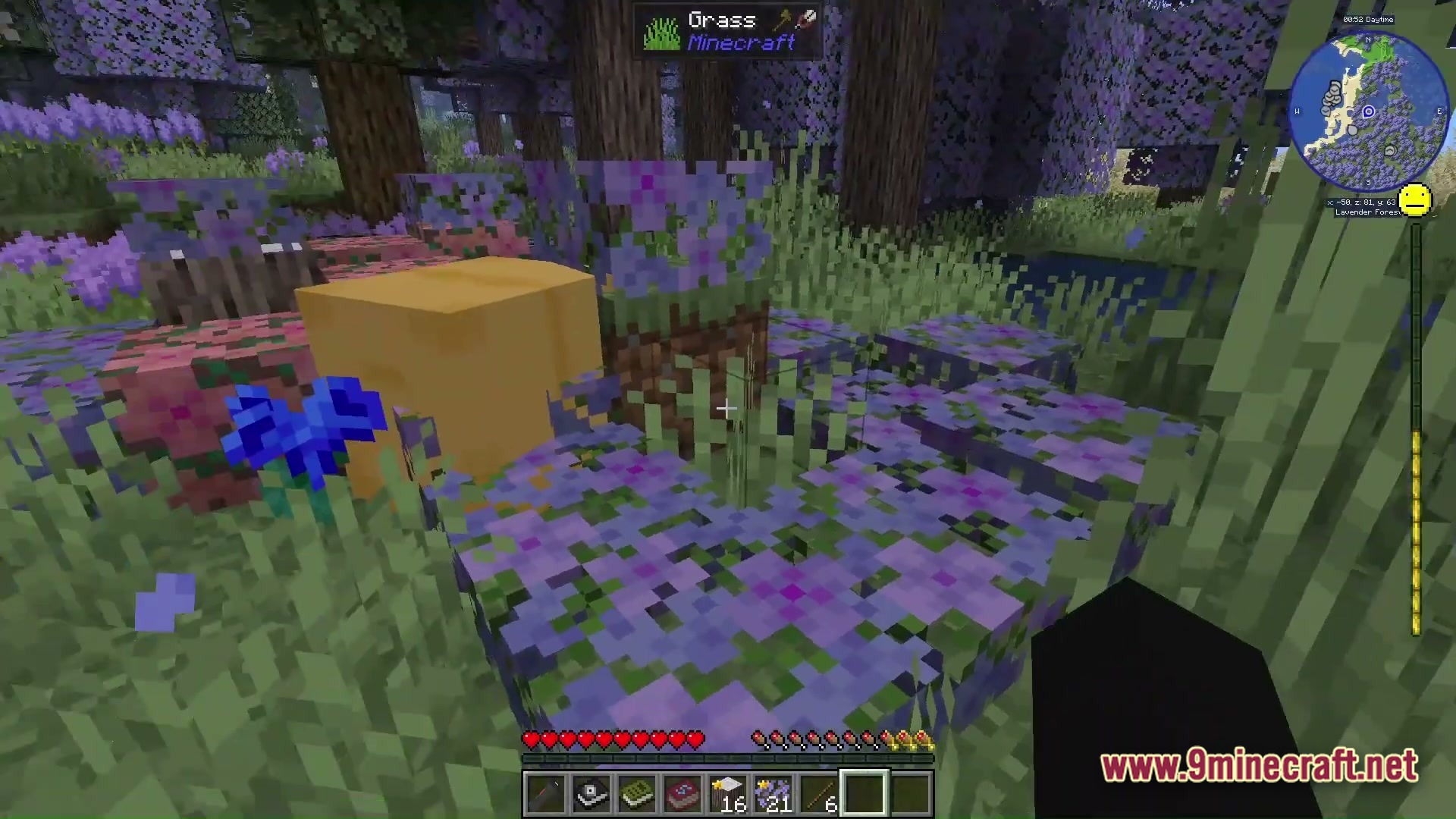 Grimsoul Unleashed Modpack Screenshot 2 A first-person view of a lavender forest biome featuring purple flowers and a yellow block