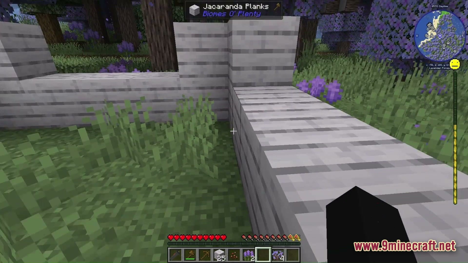 Grimsoul Unleashed Modpack Screenshot 3 A player builds a structure using Jacaranda Planks within a lavender forest biome