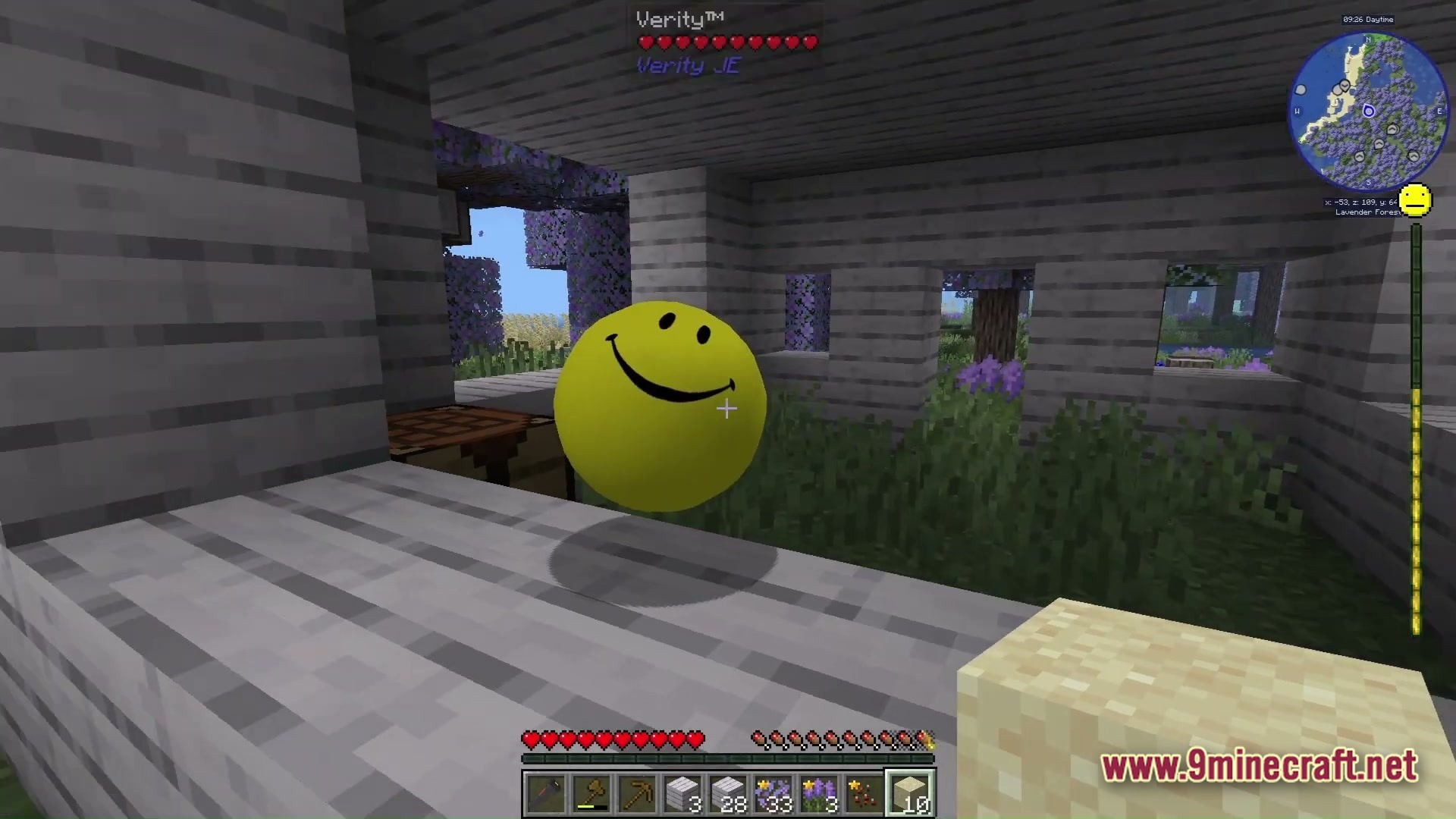 Grimsoul Unleashed Modpack Screenshot 5 A floating yellow smiley face entity inside a wooden structure within a lavender forest biome