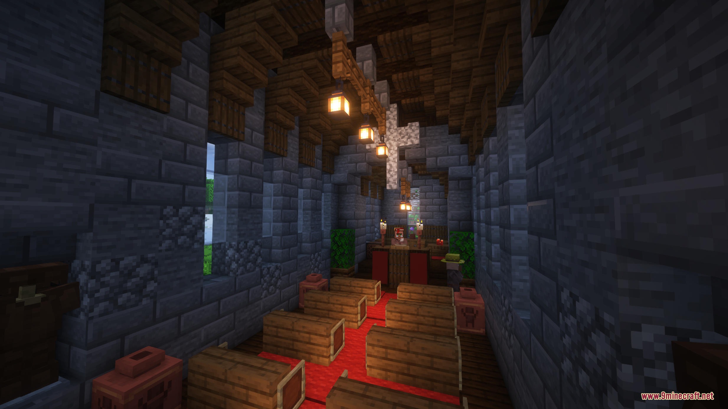 The interior of a Gothic church with wooden pews and red carpet