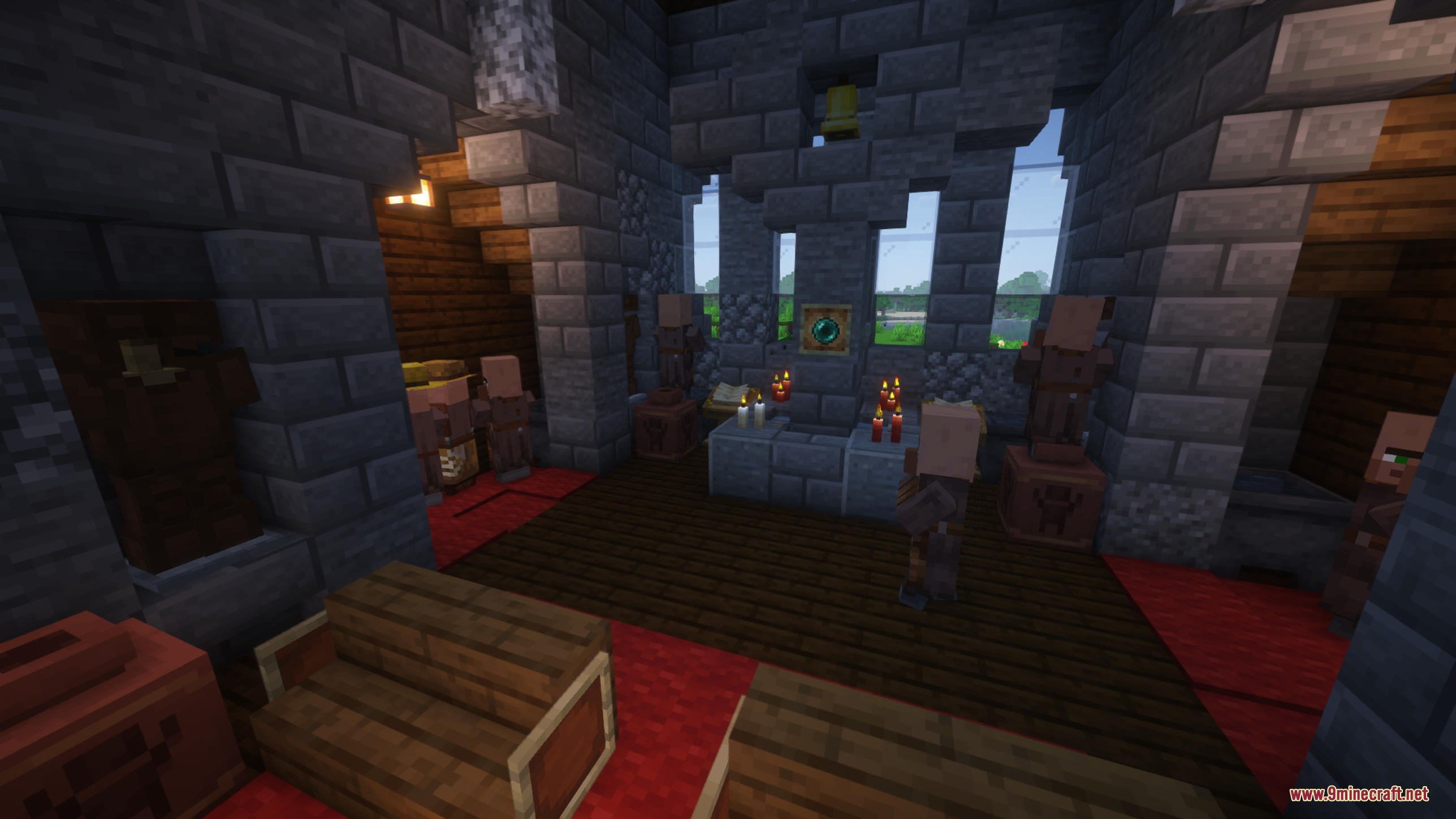 Villagers standing inside a stone church with candles and a wooden floor