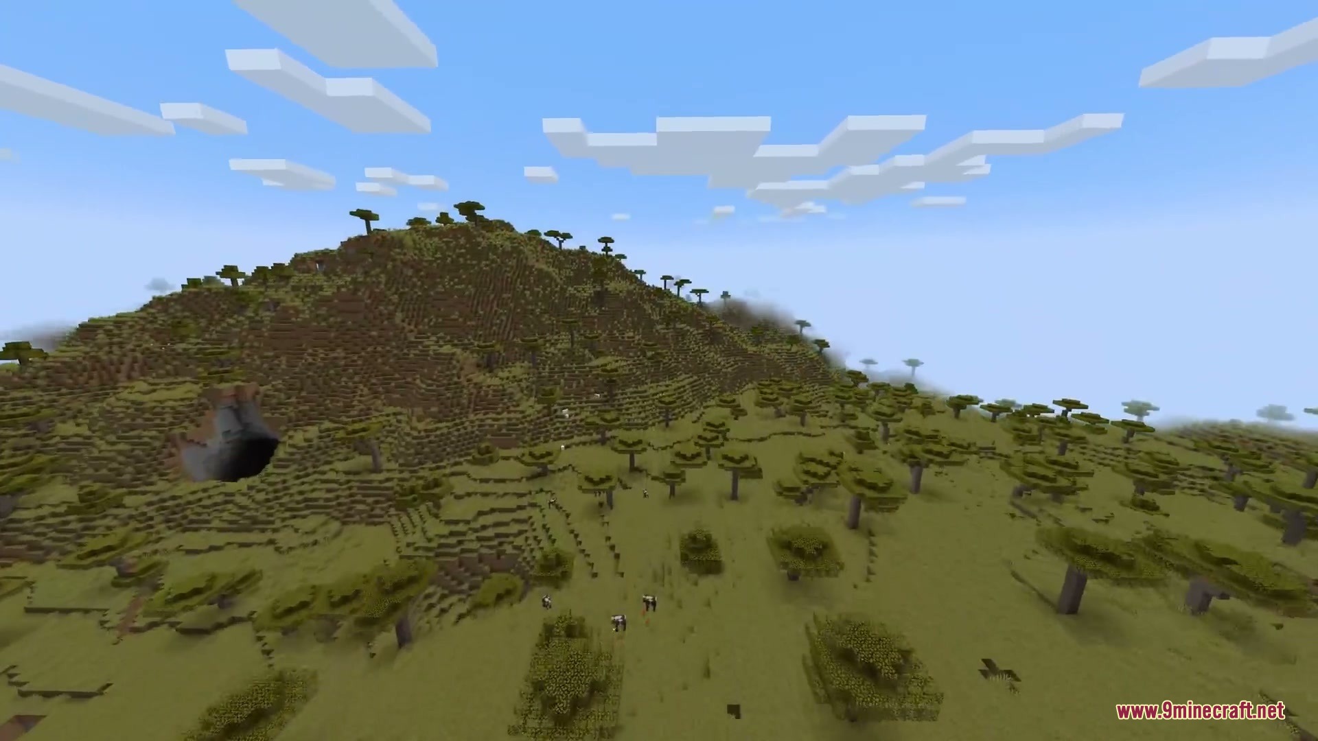 Horizon Braid Mod Screenshot 2 A vast savanna landscape with rolling hills and scattered acacia trees