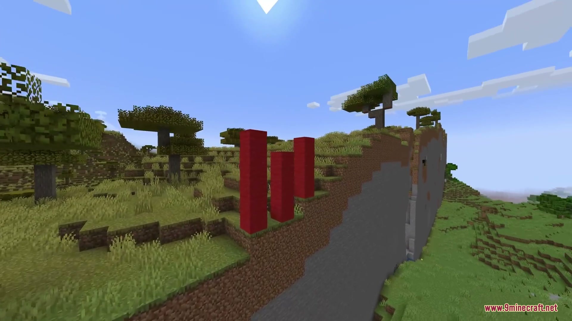 Horizon Braid Mod Screenshot 5 Red wool pillars placed near a sharp terrain border in a savanna biome