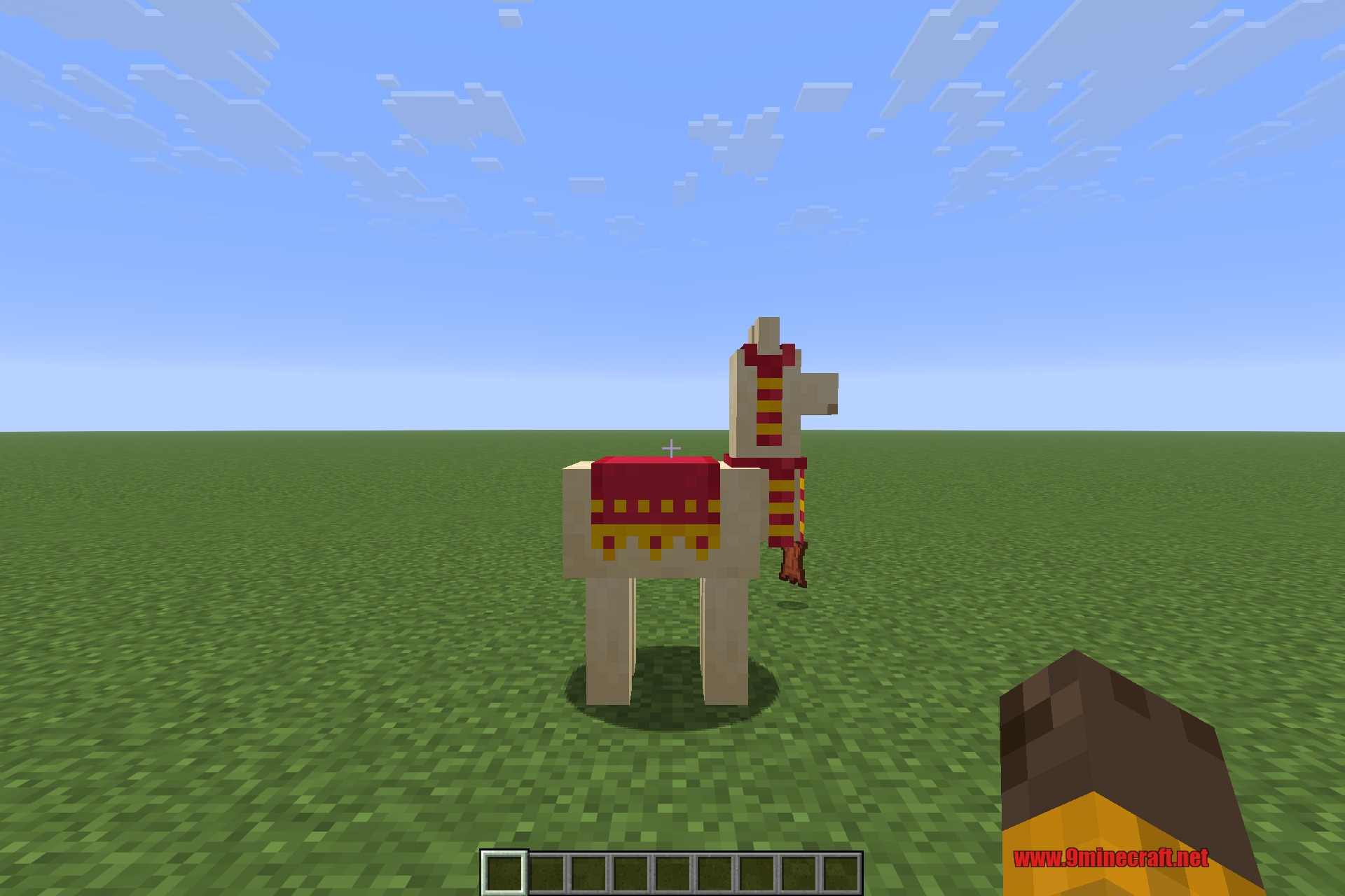 A llama wearing a red carpet