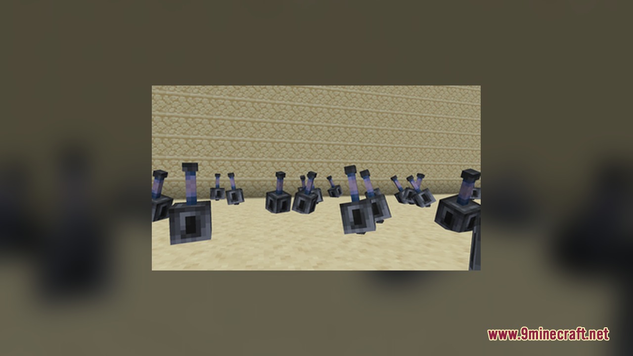 Many heavy maces scattered on the sandy ground near a sandstone wall