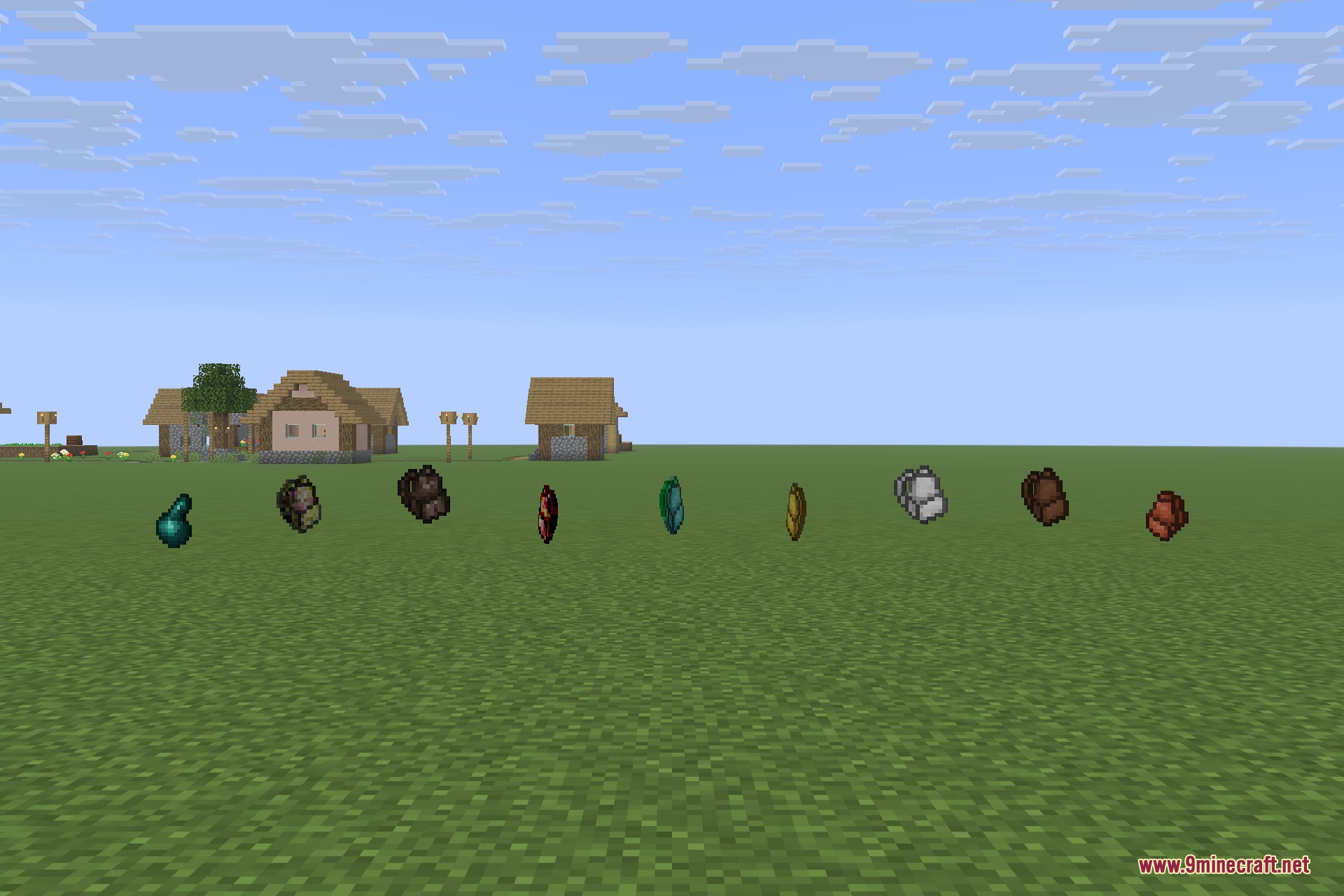 Various colorful backpacks floating in a line on a green grass field