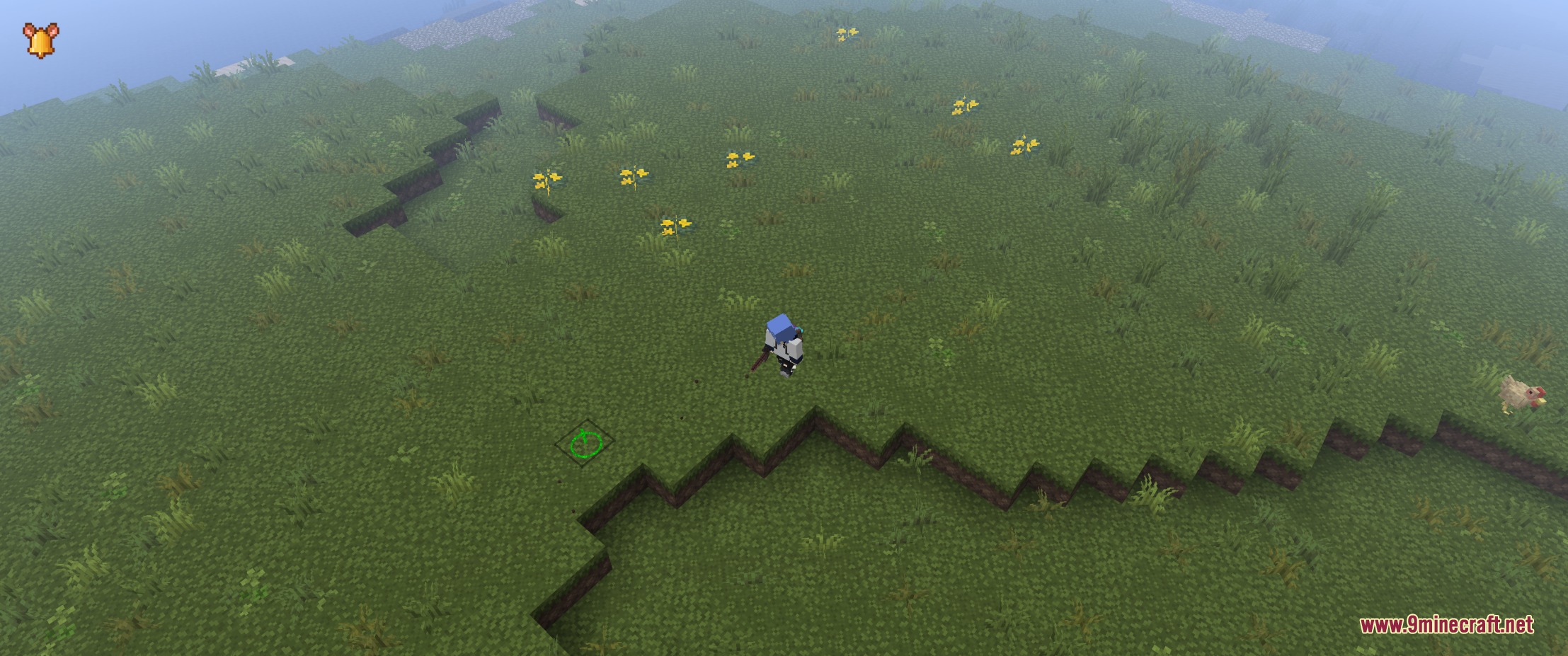 A green navigation ring marker on the grass in a top down view