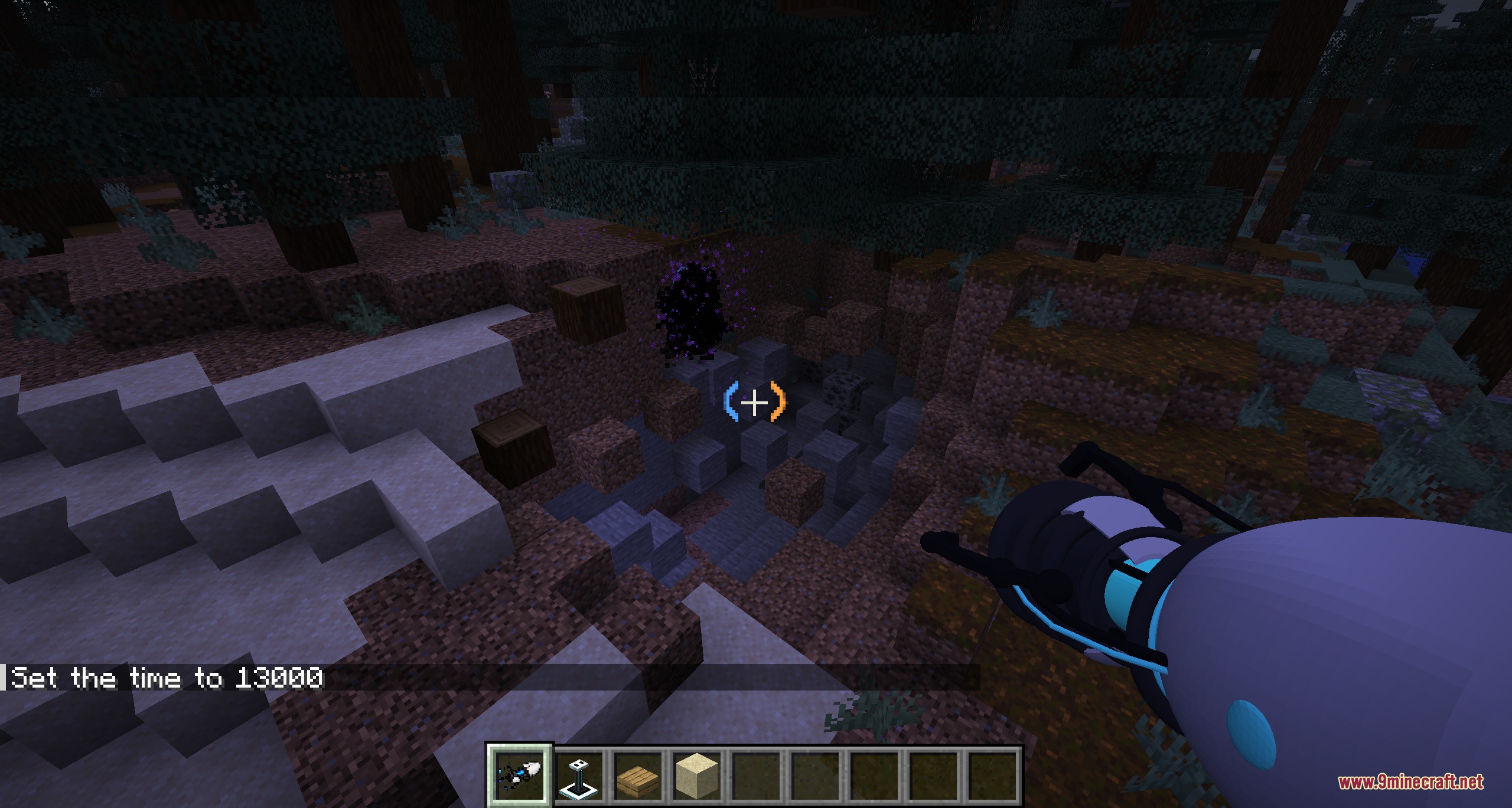 Player uses a portal gun to create a dark swirling portal at night