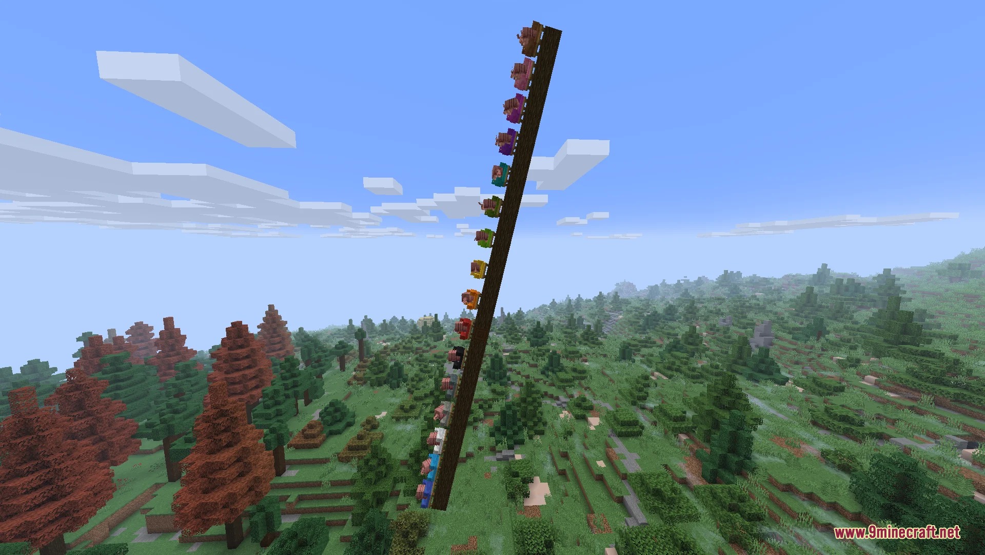 A tall pillar of colorful sheep riding a moving contraption in Minecraft