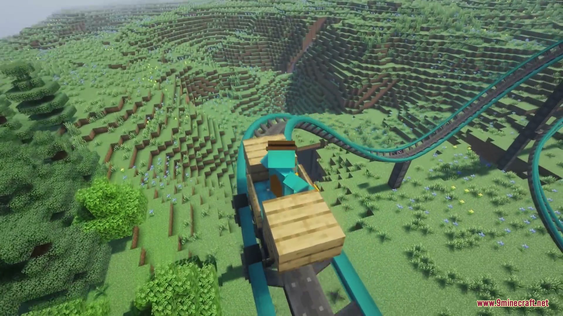 Kinetic Rail Rush Mod Screenshot 2 Player riding a wooden cart down a steep drop on teal roller coaster tracks