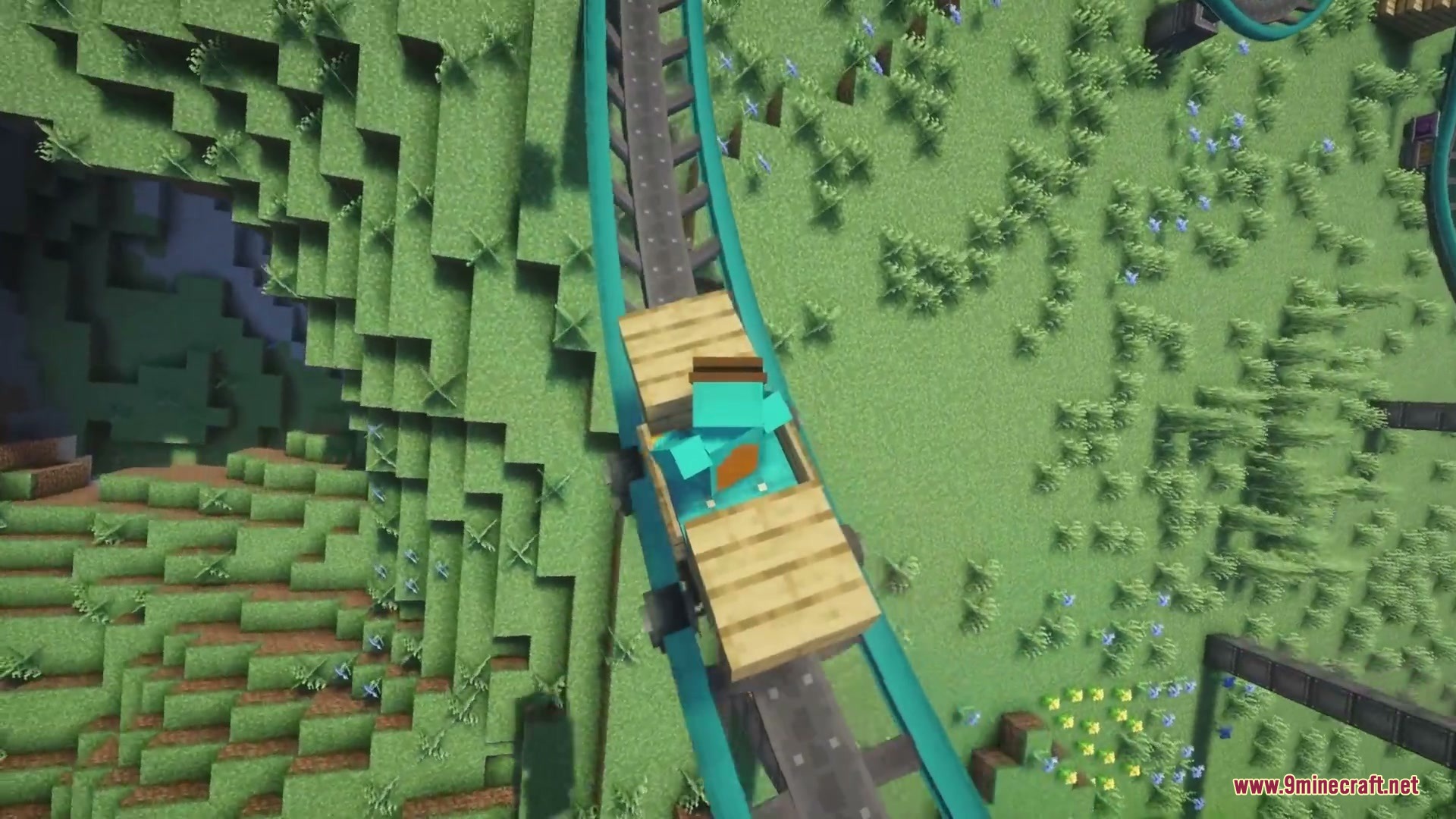 Kinetic Rail Rush Mod Screenshot 3 Player riding a wooden coaster cart on a teal track from above