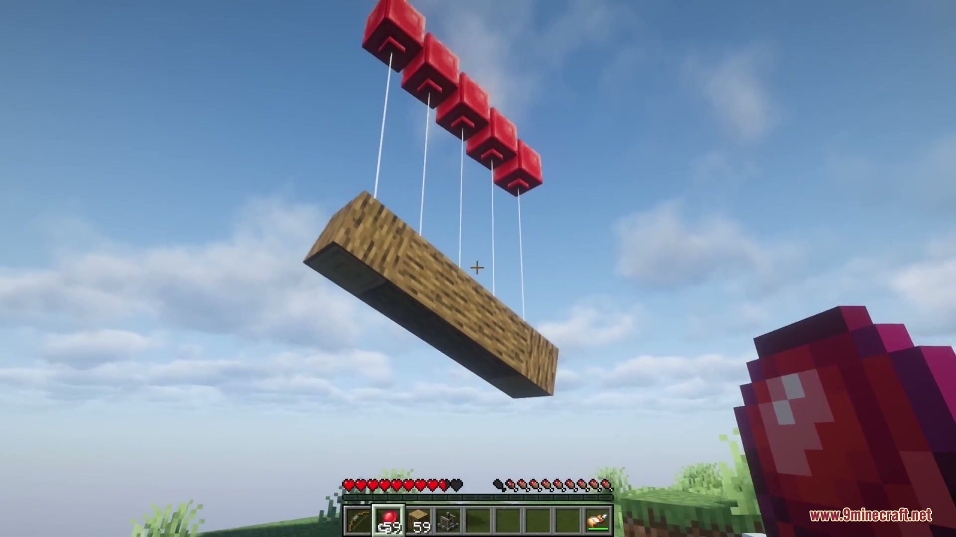 Kinetic Rail Rush Mod Screenshot 7 Red balloons lifting a wooden log contraption high up in the sky