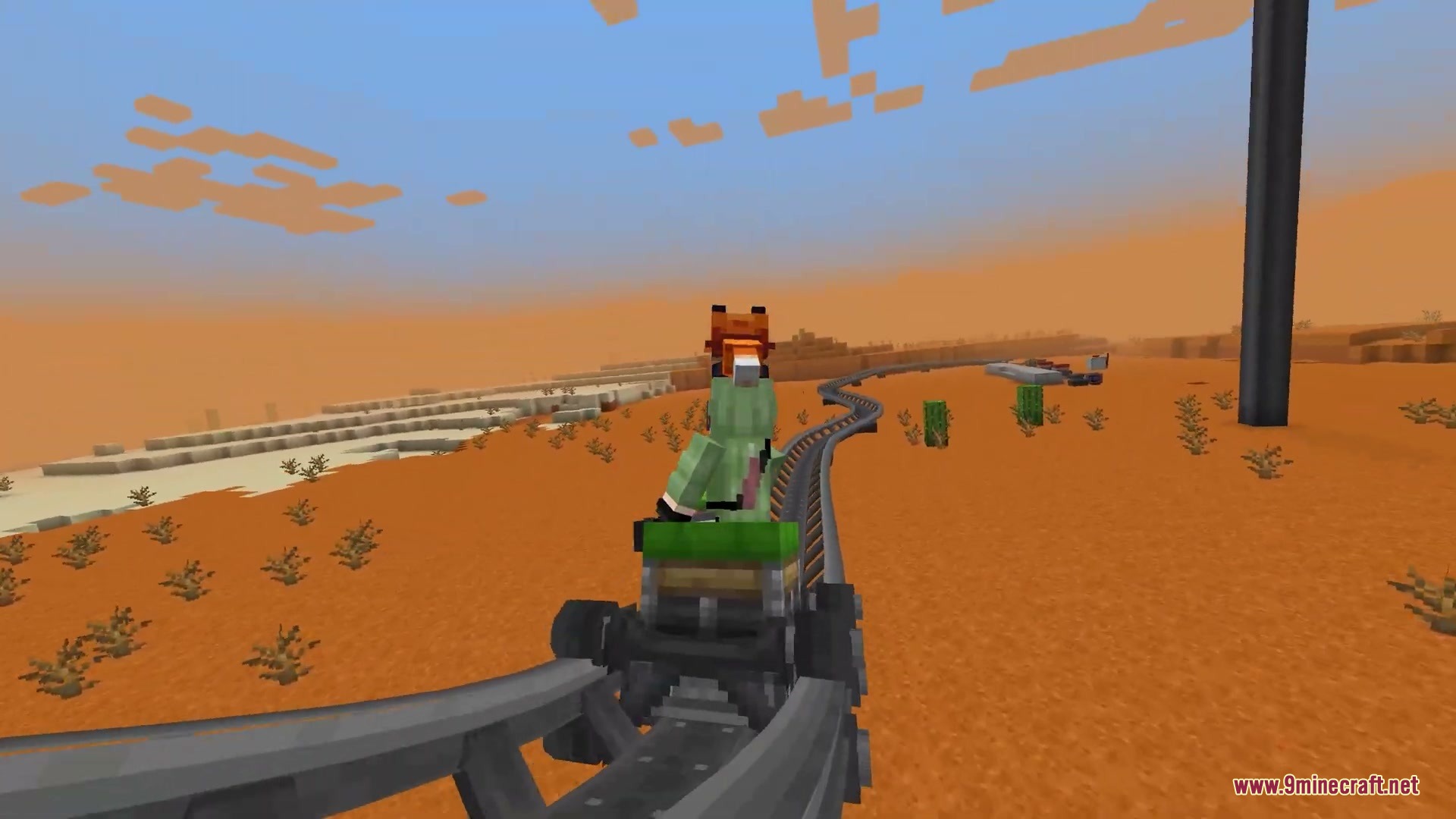 Kinetic Rail Rush Mod Screenshot 8 A player riding a roller coaster cart along curved tracks in the desert