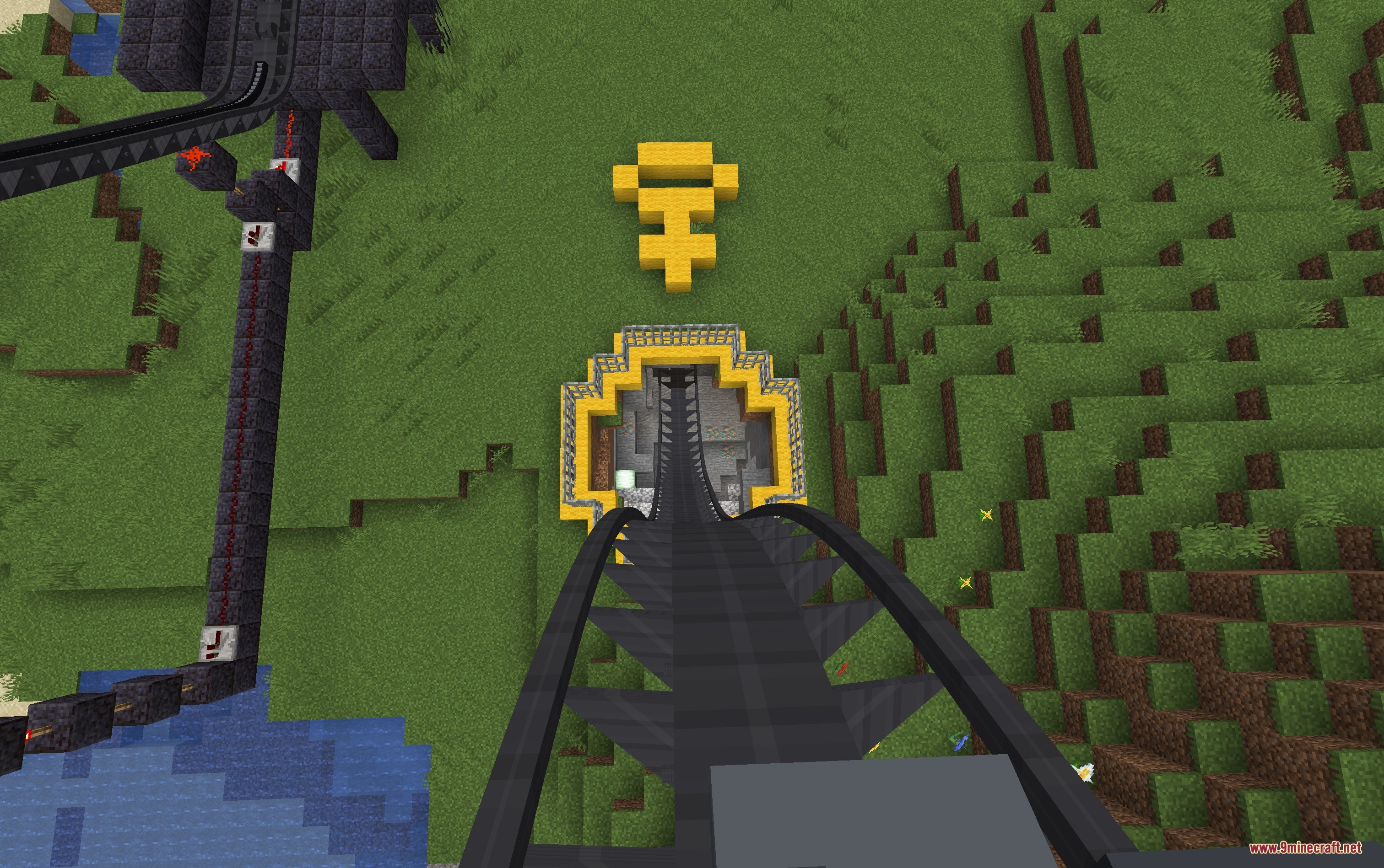 Kinetic Rail Systems Mod Screenshot 2 First person view of a steep roller coaster drop into a yellow tunnel