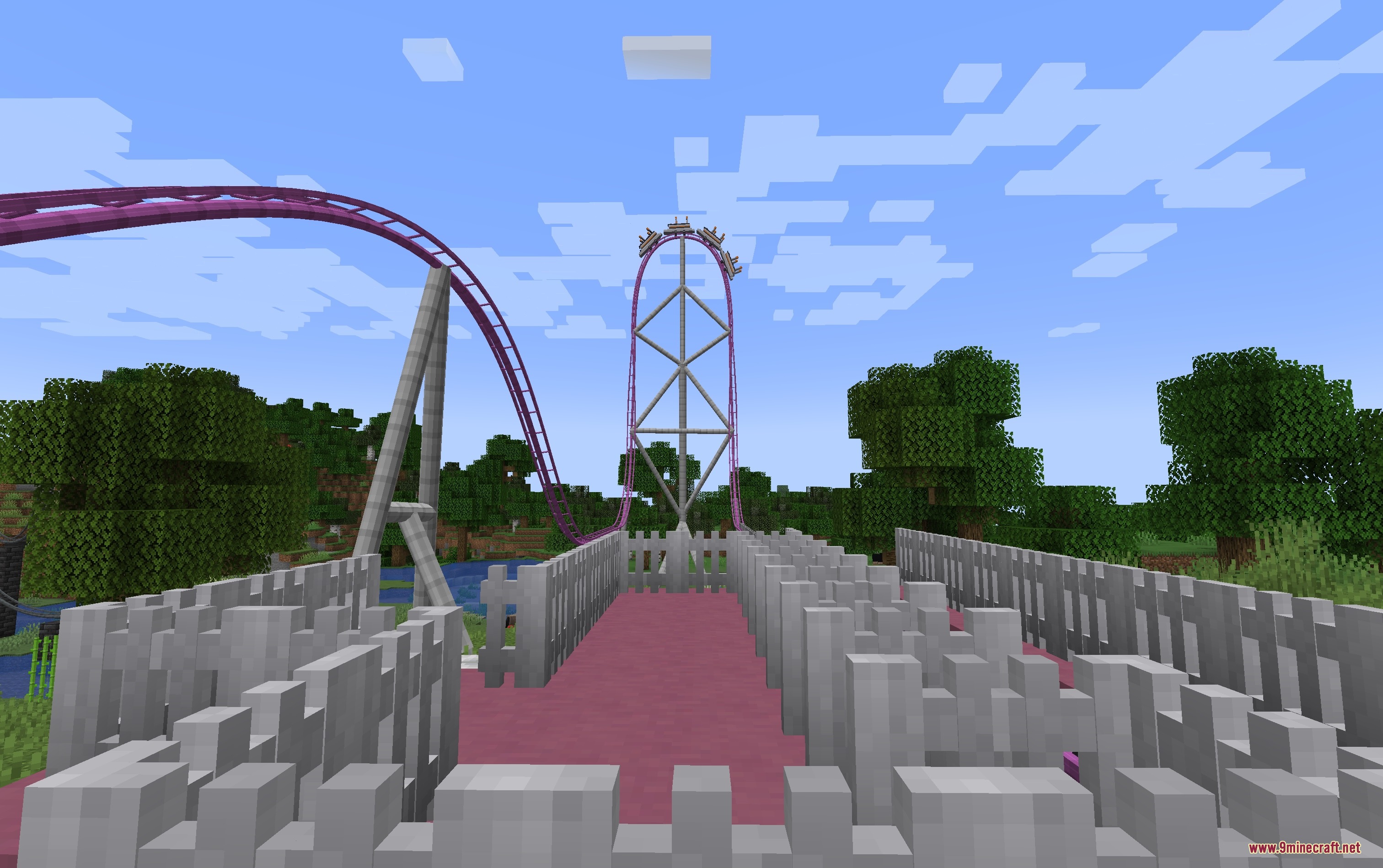 Kinetic Rail Systems Mod Screenshot 6 Pink roller coaster train climbing a tall vertical drop over green trees