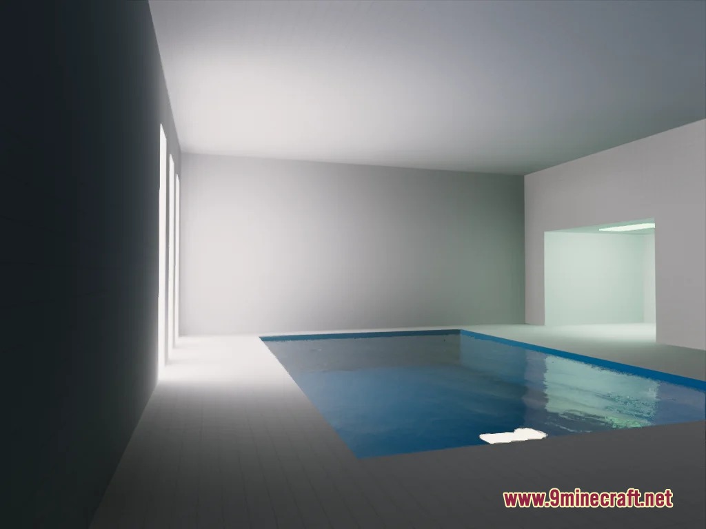 A minimalist indoor pool area with white walls and bright lighting