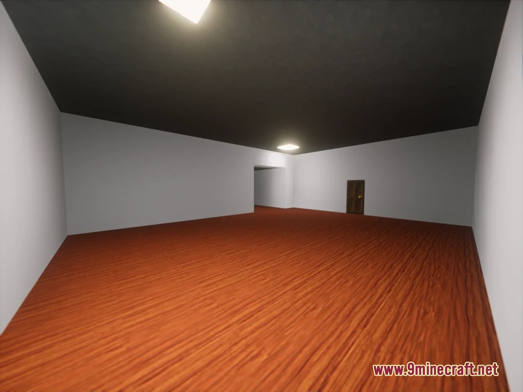 Spacious room with white walls and dark wooden flooring featuring a single door