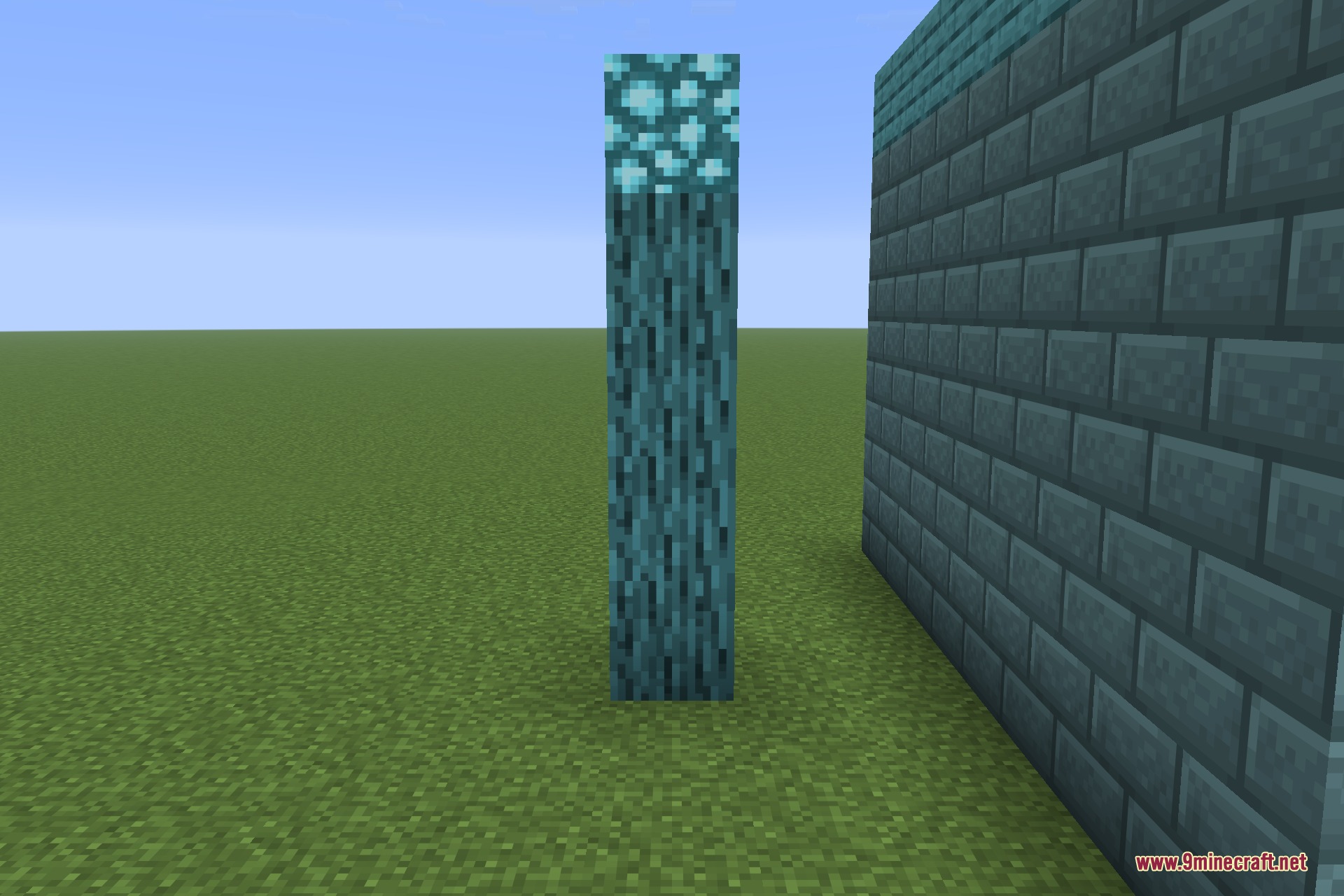A restyled log column beside a wall, lit from above