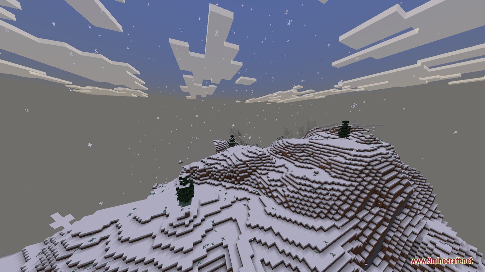 Snowy mountain peaks with spruce trees during a heavy snowfall in Minecraft