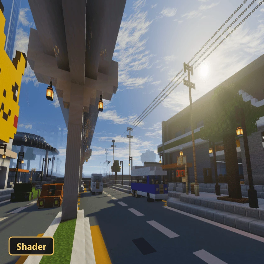 sunny day in a modern city with roads, buildings, and a Pikachu statue