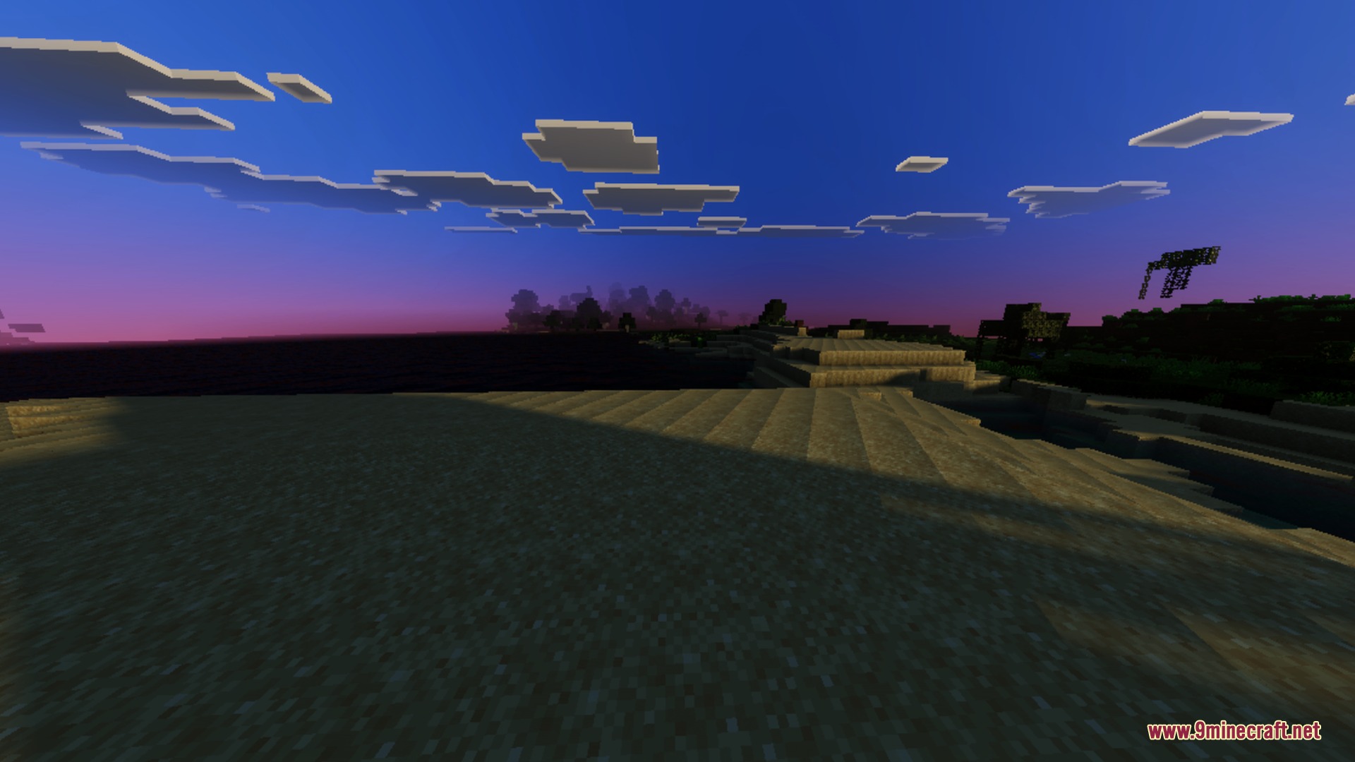 Vibrant sunset colors painting the sky over a peaceful Minecraft beach landscape