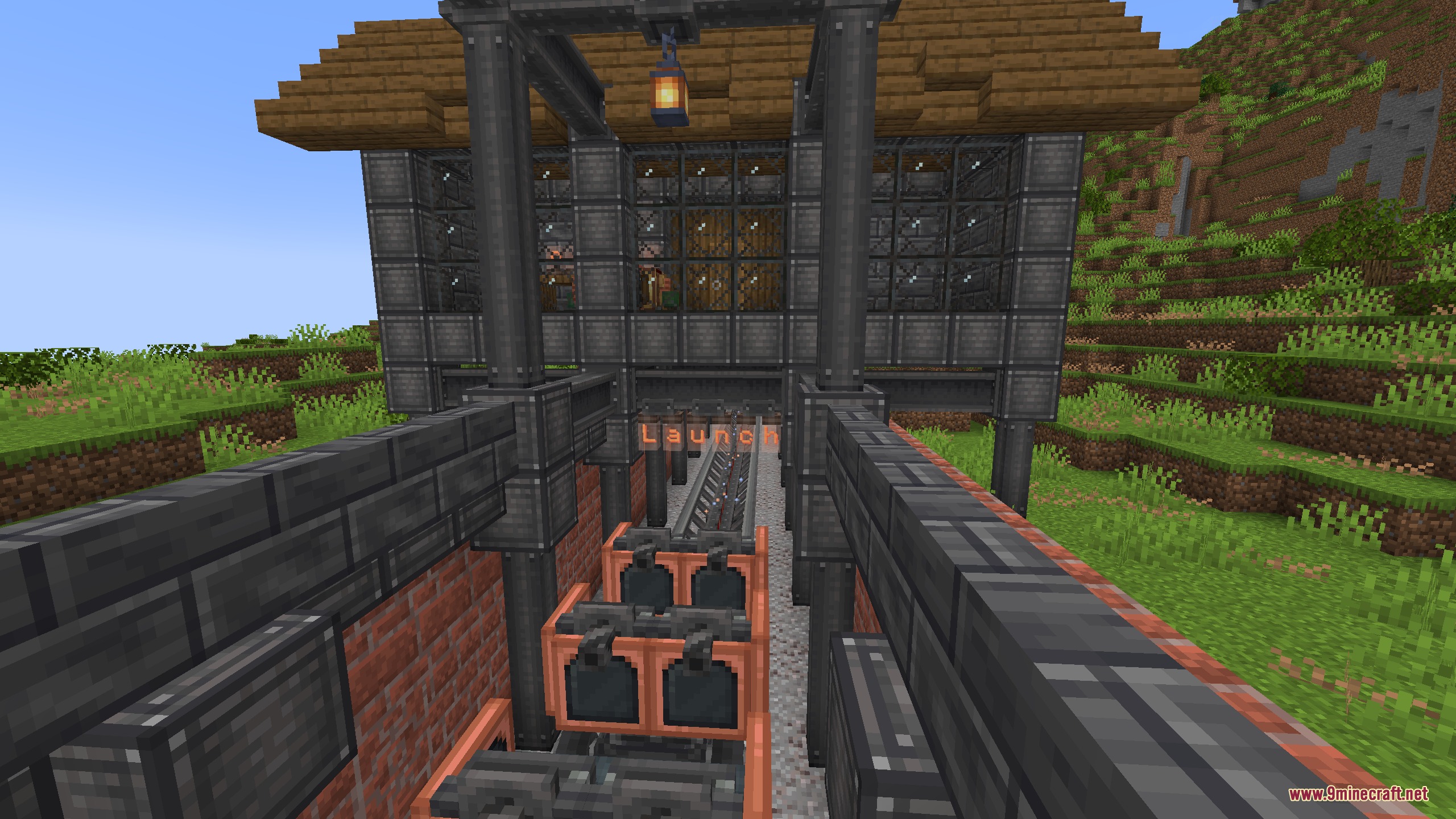 Magnetic Velocity Rail Mod Screenshot 1 Coaster cart positioned on a magnetic launch track in front of a building