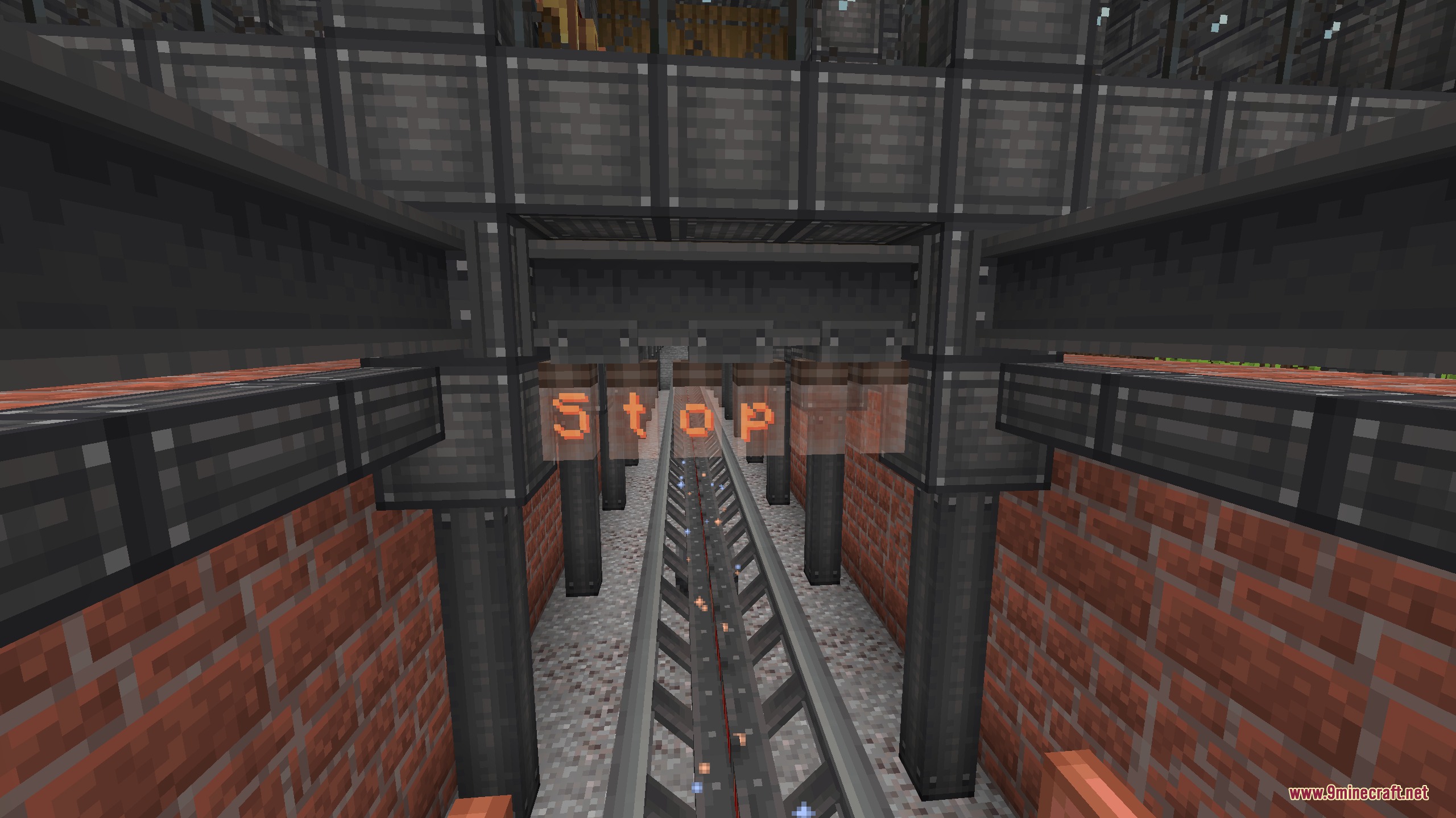 Magnetic Velocity Rail Mod Screenshot 5 Magnetic rail track passing under a glowing stop sign in a brick tunnel