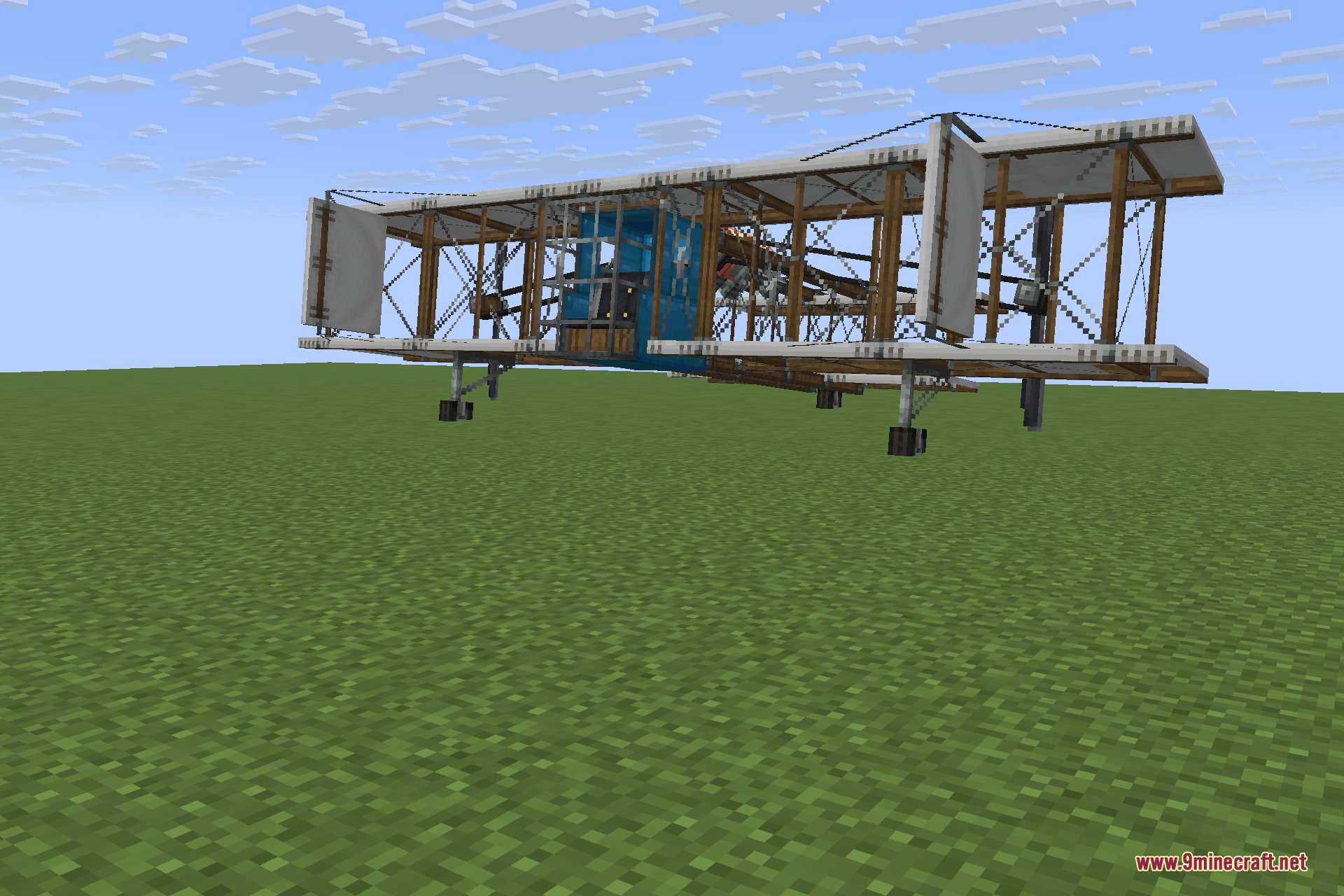 Man of Many Planes 9minecraft Mod Screenshot 4 A large wooden economy plane with a glazed cockpit on the grass