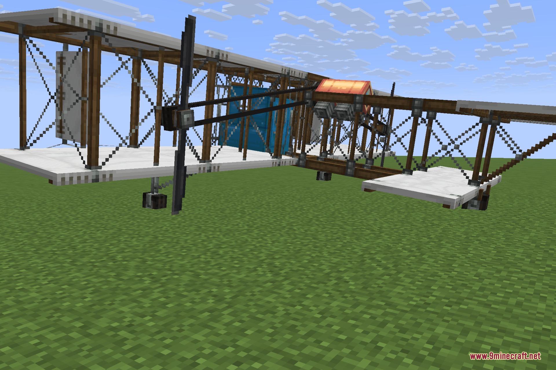 Man of Many Planes 9minecraft Mod Screenshot 5 Large wooden airliner with multiple wings parked on a flat grass field
