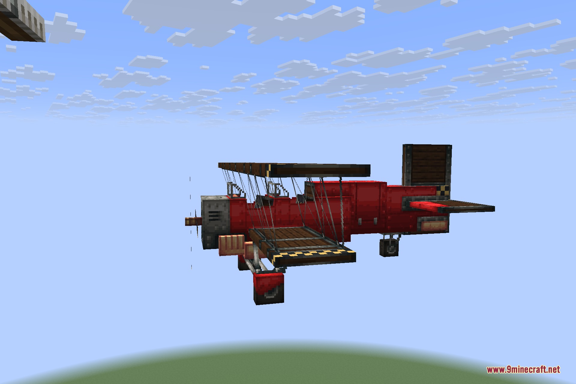 Man of Many Planes 9minecraft Mod Screenshot 7 A bright red Scarlet Biplane flying through the clear blue Minecraft sky