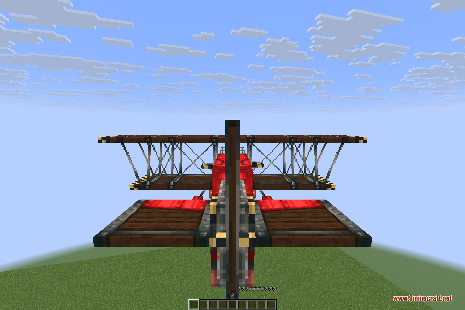 Man of Many Planes 9minecraft Mod Screenshot 9 A red Scarlet Biplane with wooden wings flying in the Minecraft sky