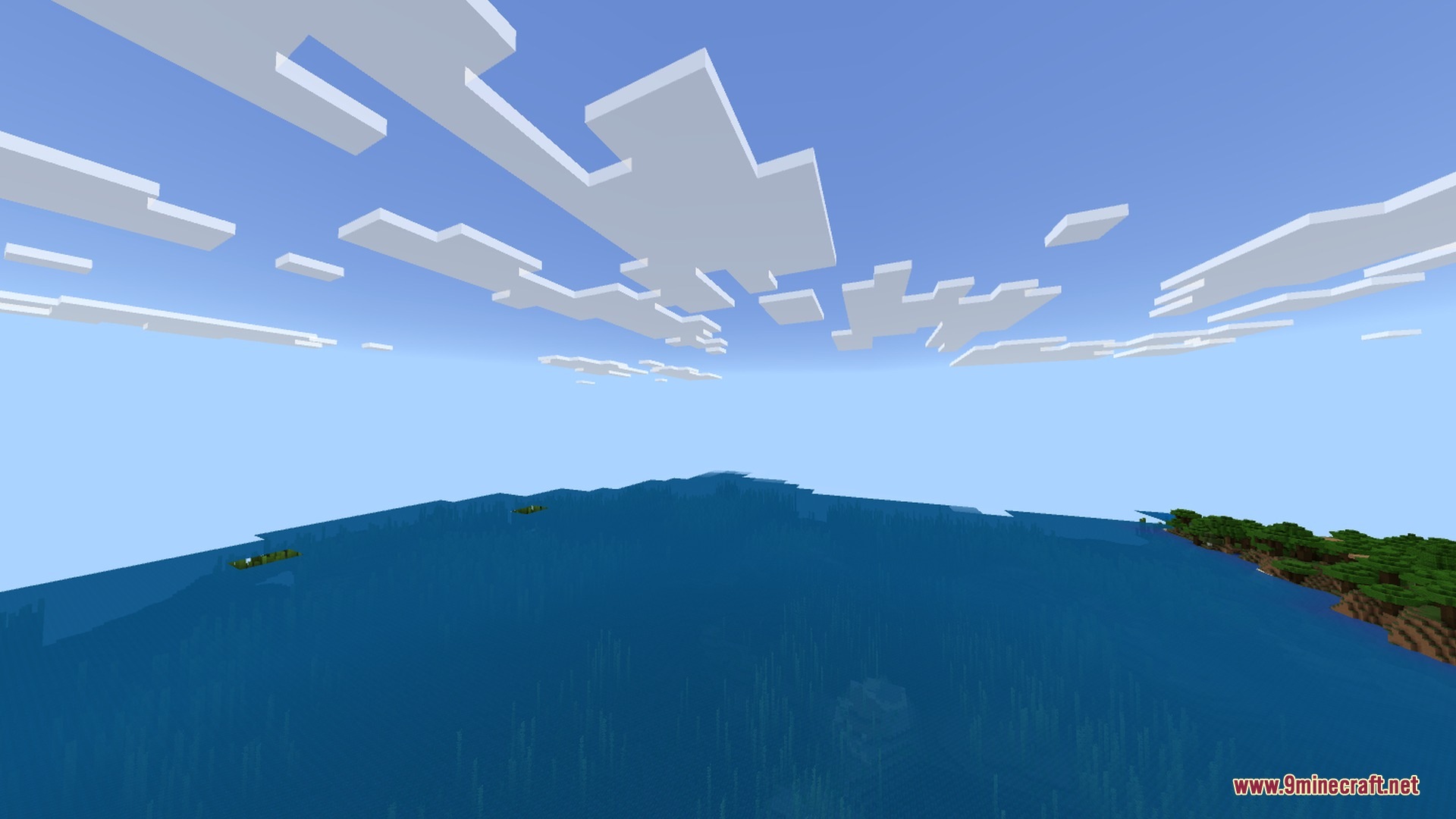 Mobile Ores Fps + Shader Screenshot 6 A vast blue ocean surface with a green forested coastline on the right
