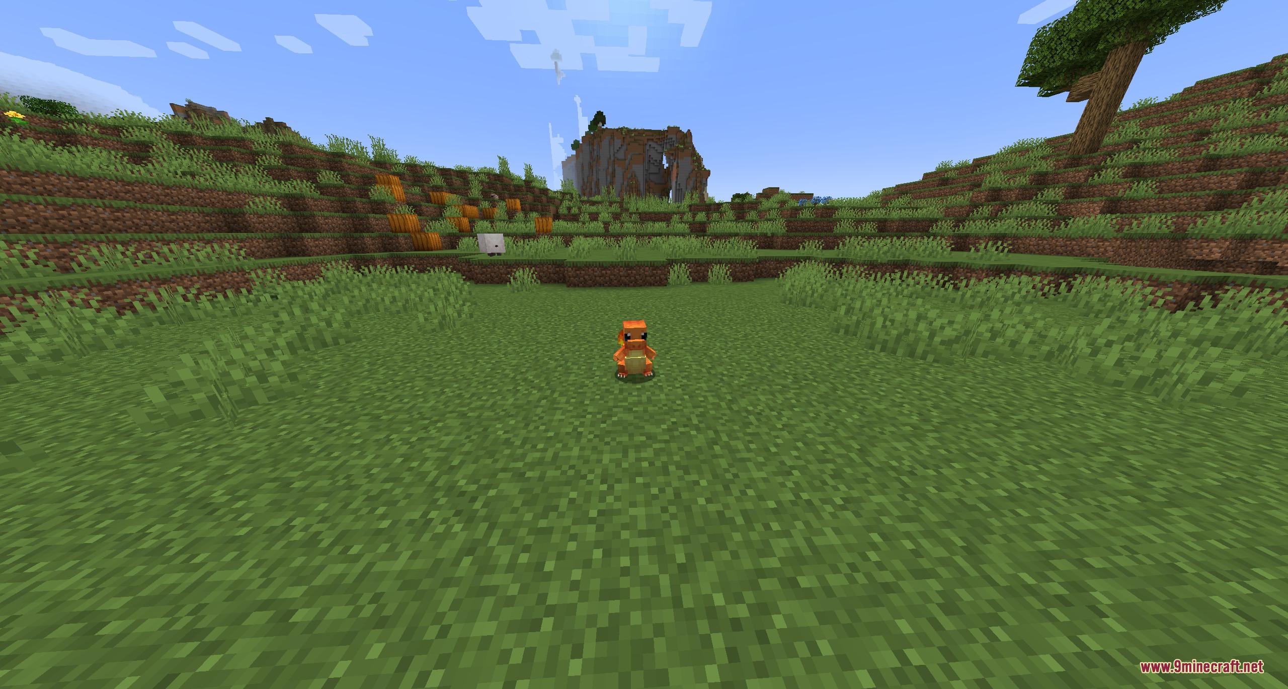 Monbarrier Invisible Boundary Mod Screenshot 1 A Charmander pokemon stands in a grassy field under a clear sky