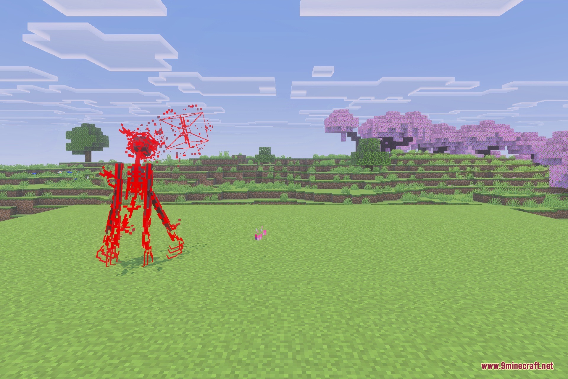A mysterious red skeletal mob stands in a field of green grass