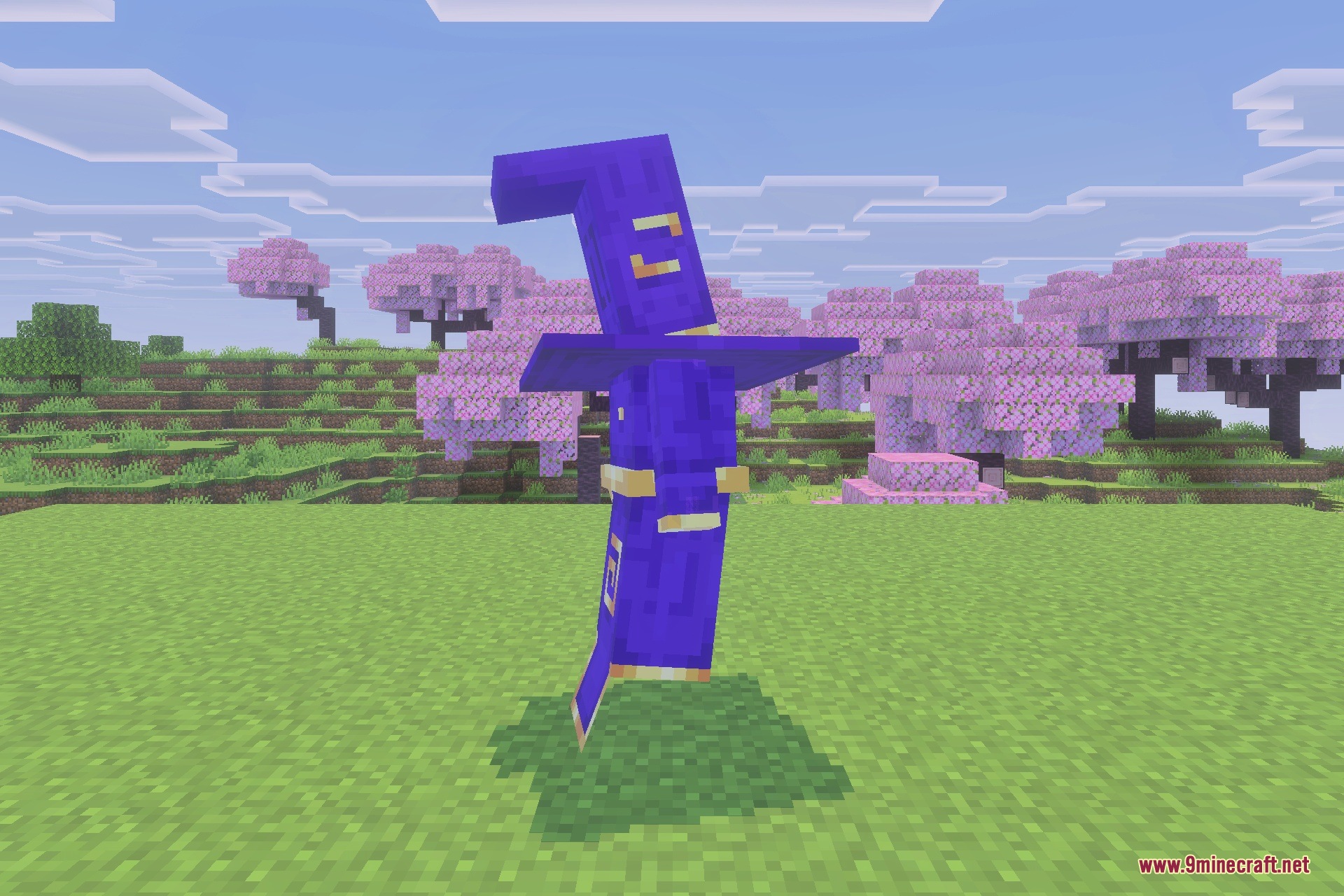 A purple wizard armor set displayed on grass in a cherry blossom biome