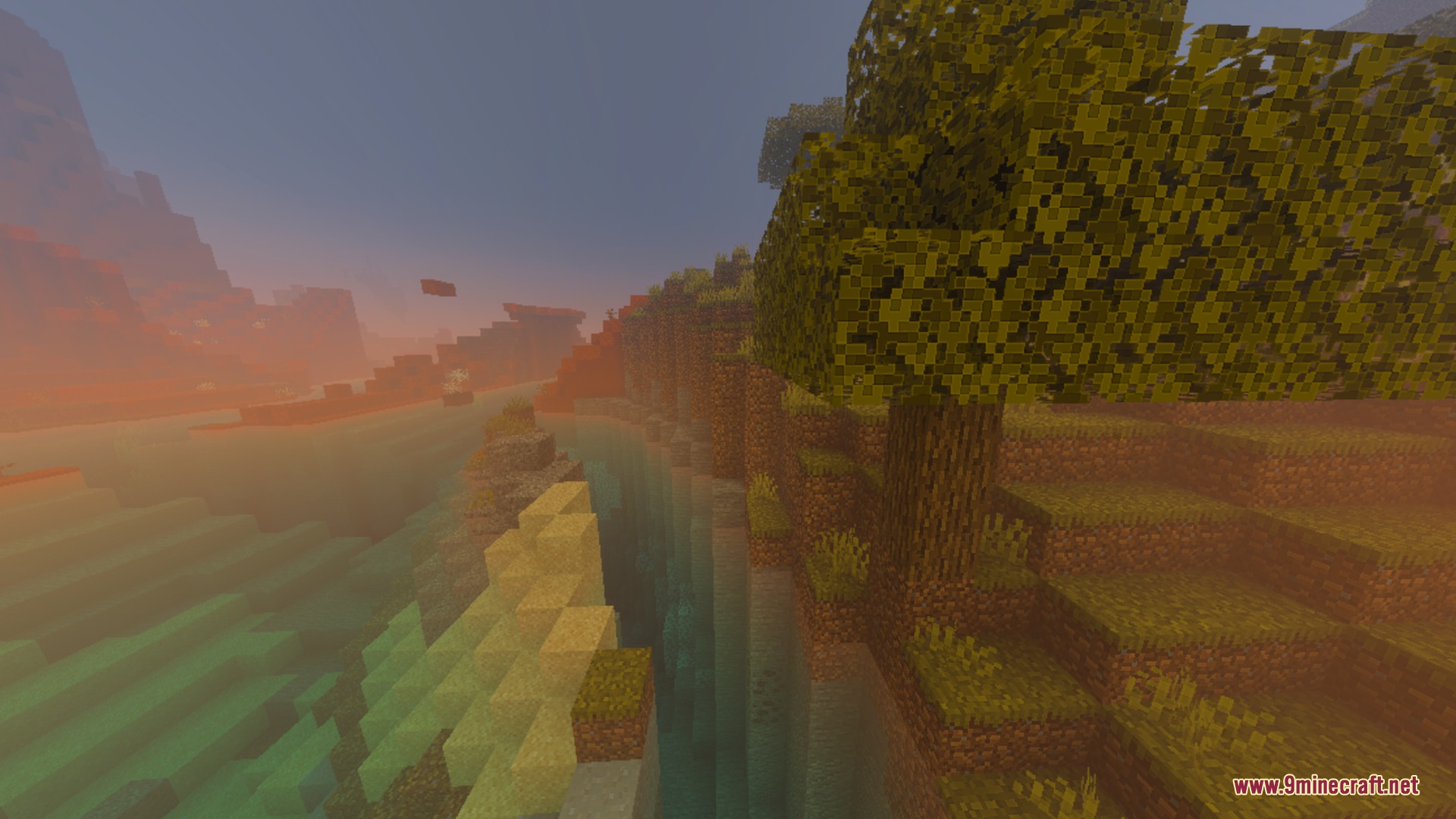 A tree stands on a cliff overlooking a hazy sunset Minecraft landscape